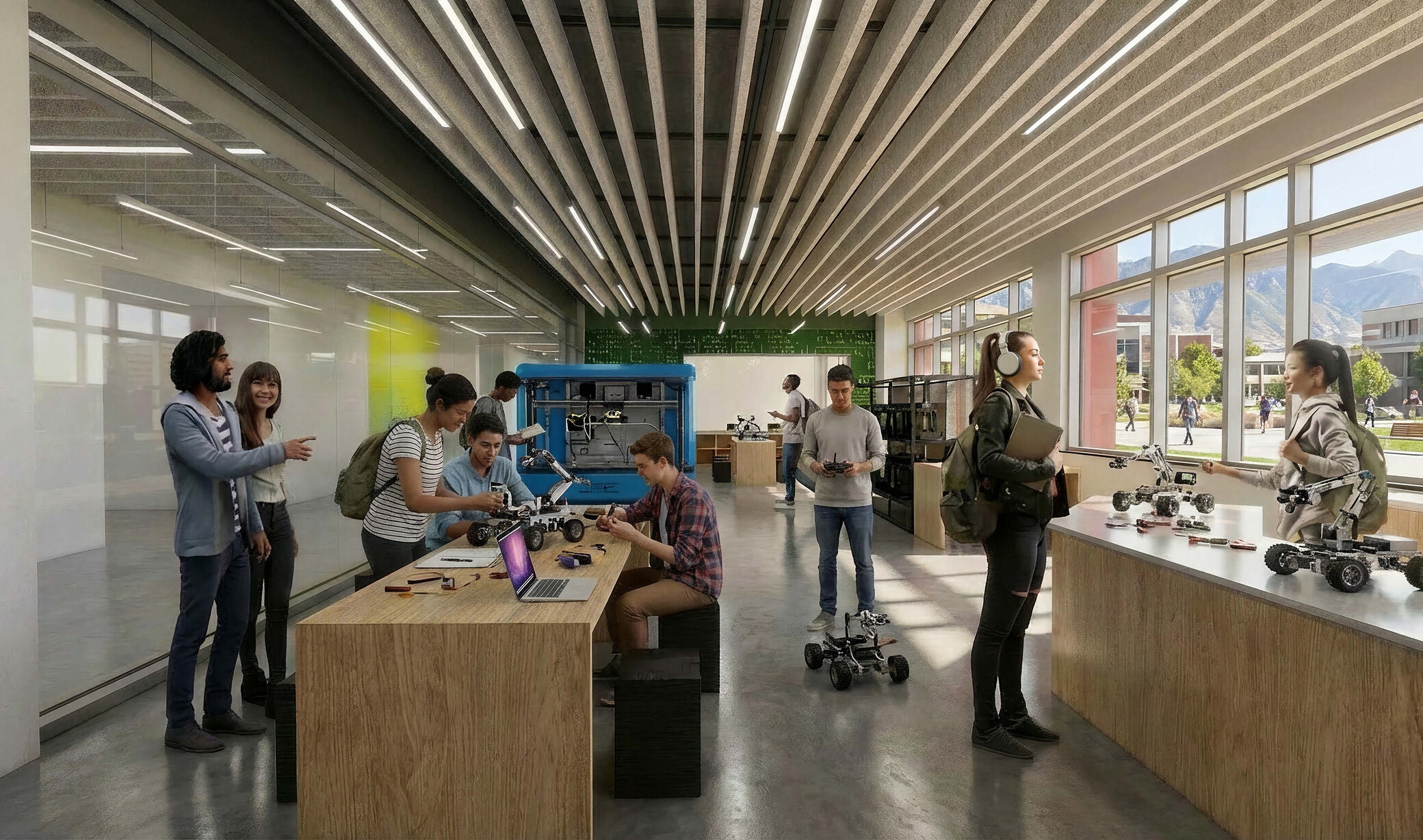 students sitting and working at stations in a technical classroom with 3D printers; materials; etc.
