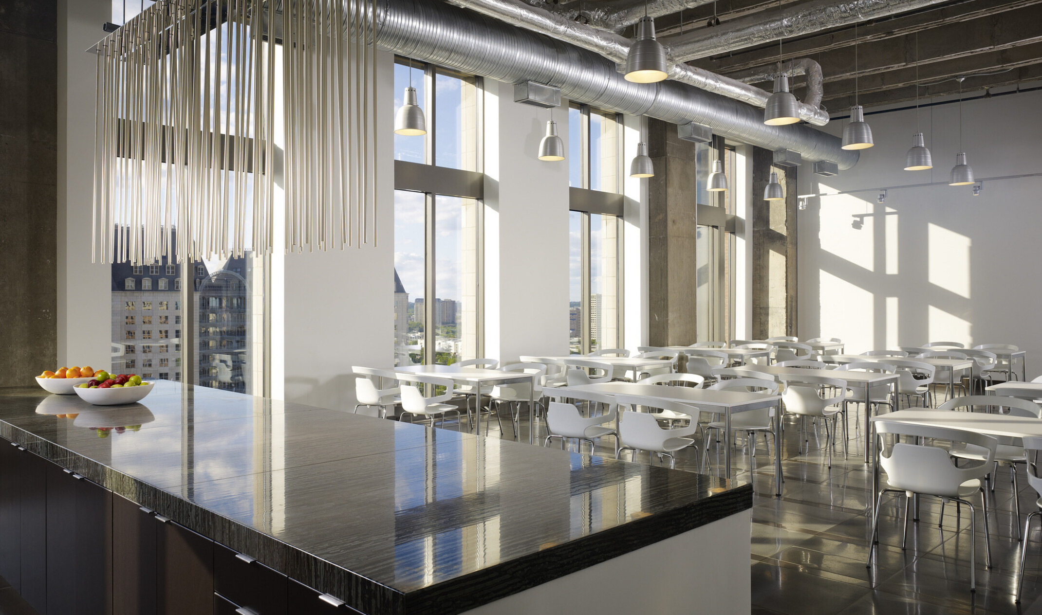 modern workplace interior kitchen; neutral tone walls and furniture