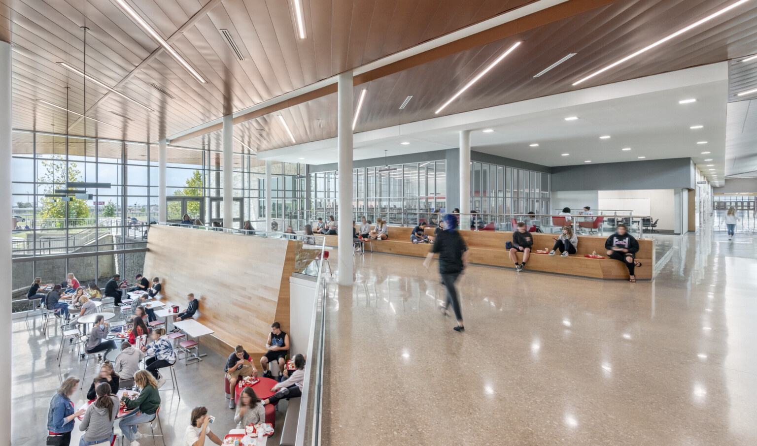 Mezzanine overlooking cafeteria with high ceilings and columns. Mezzanine overlooking cafeteria with high ceilings and columns.
