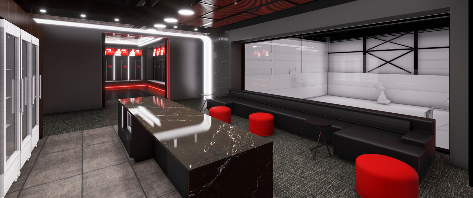 Lounge area with red seating and black walls looking into locker room