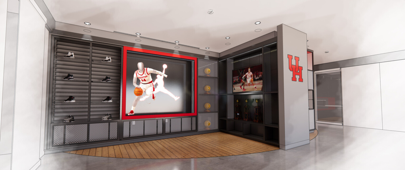 Shoes displayed on a wall with big screen accented in red with TV and University of Houston logo