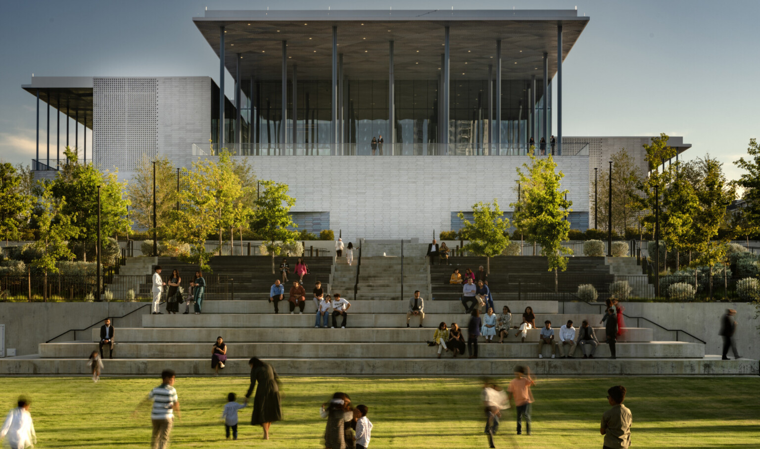 Front lawn of Ismaili Center, Houston; people playing in grass