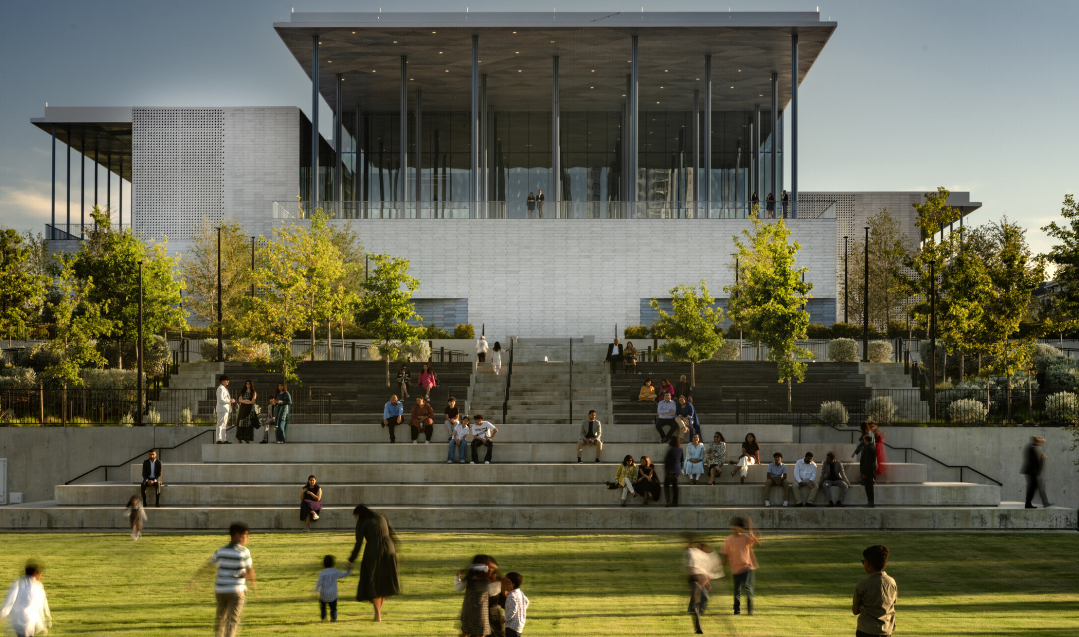 Front lawn of Ismaili Center, Houston; people playing in grass