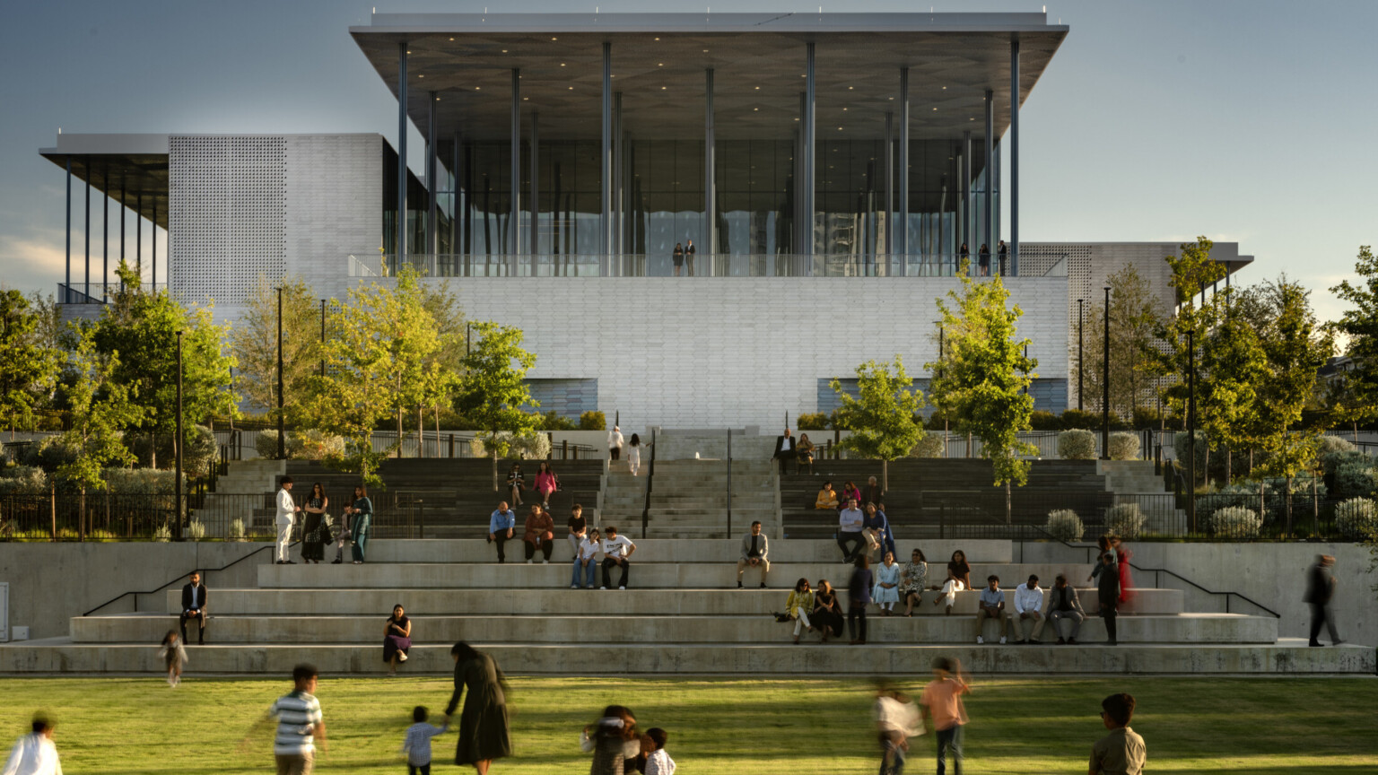 Front lawn of Ismaili Center, Houston; people playing in grass