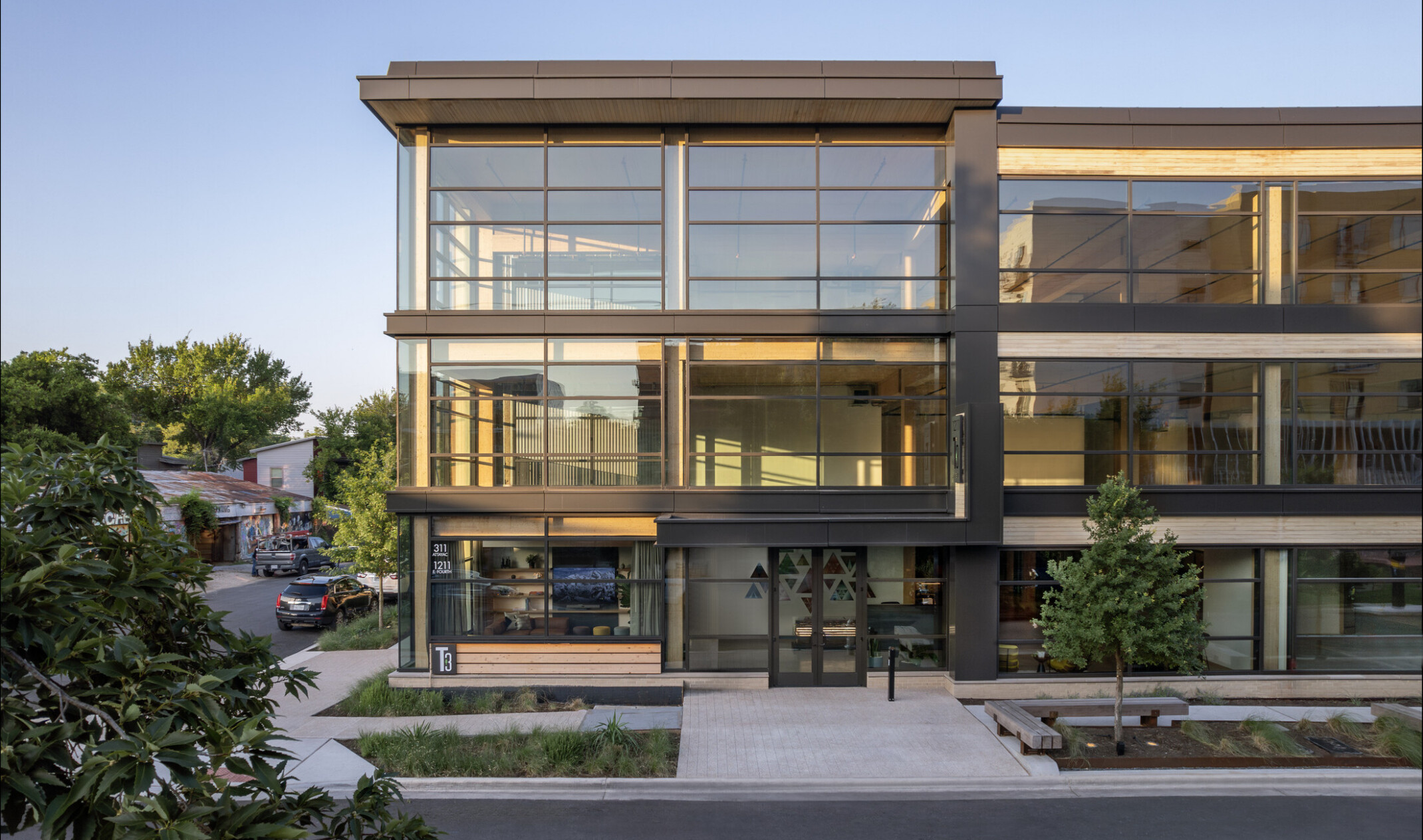 workplace mass timber building with floor to ceiling windows