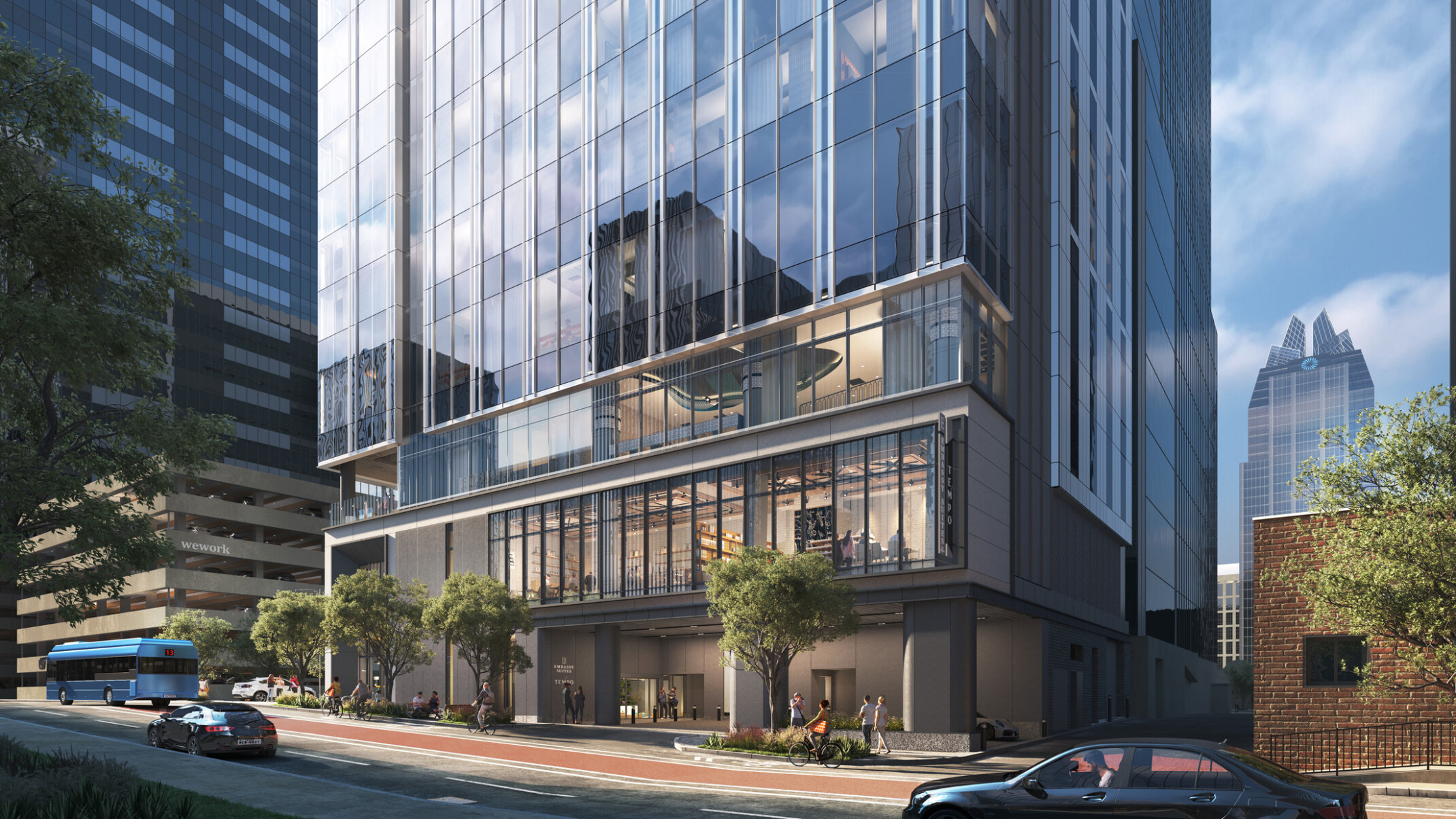 Rendering of the ground-floor motor court at the Embassy Suites and Tempo by Hilton dual-brand hotel in downtown Austin, with a glimpse into the two-story restaurant space beyond