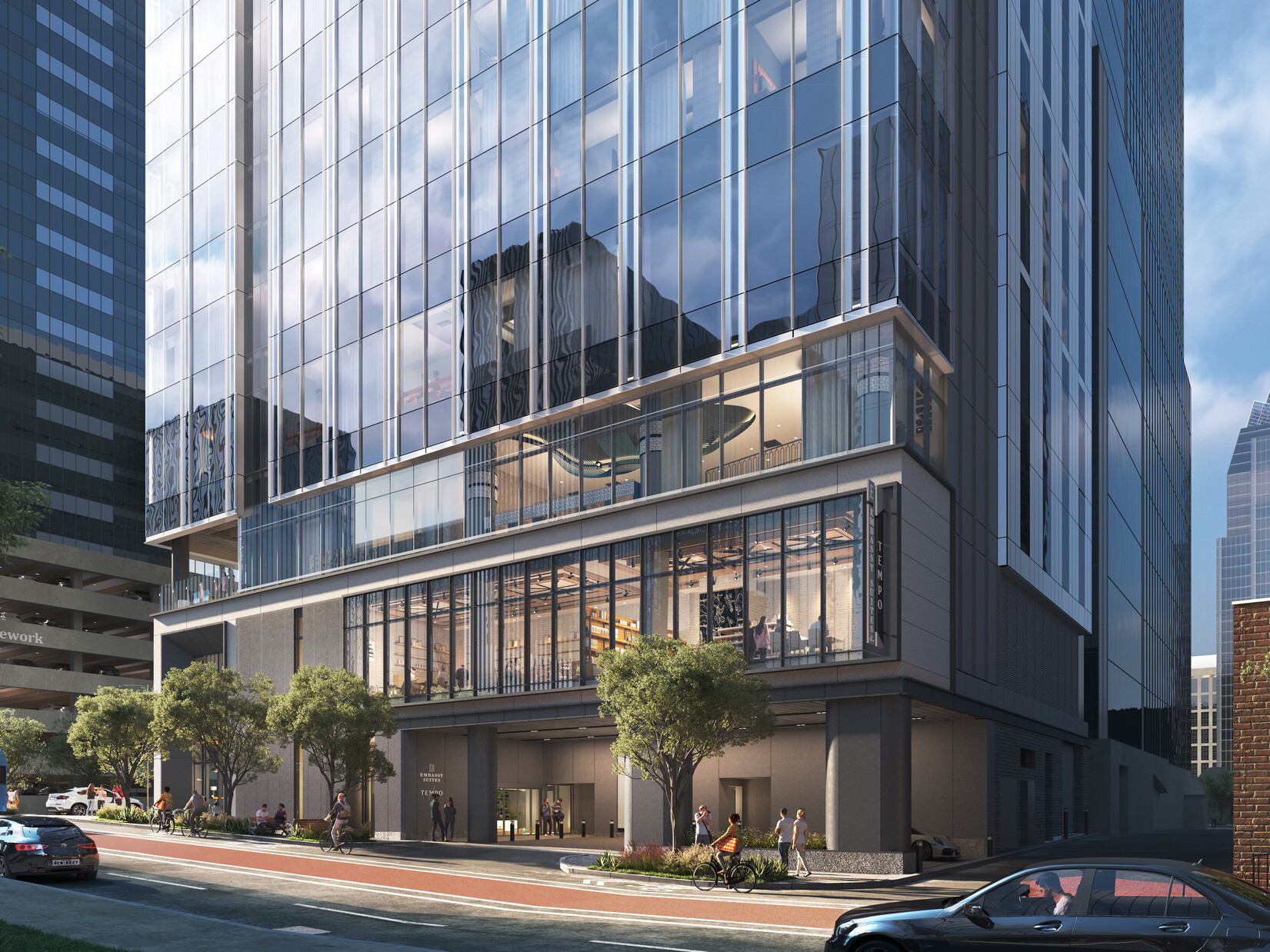 Rendering of the ground-floor motor court at the Embassy Suites and Tempo by Hilton dual-brand hotel in downtown Austin, with a glimpse into the two-story restaurant space beyond