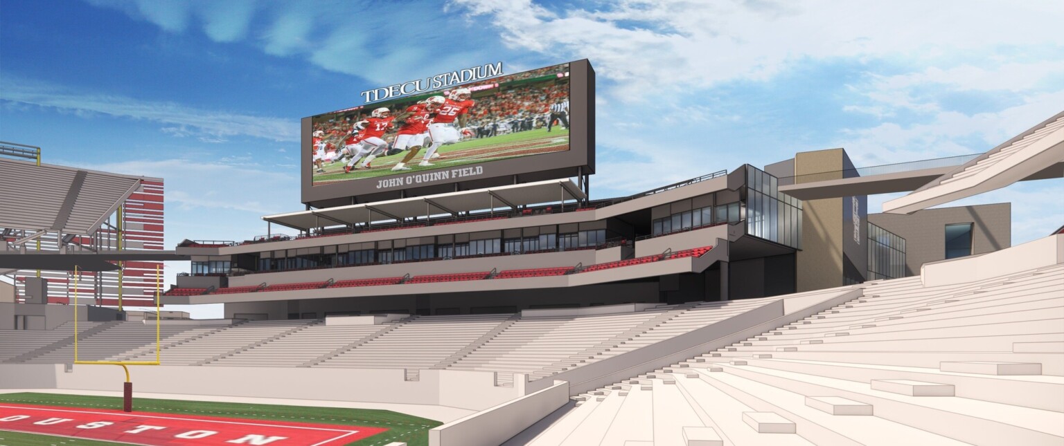 rendering of new football stadium complex, with massive jumbo-tron screen, seating and field with team branding, press boxes, blue skies with light clouds