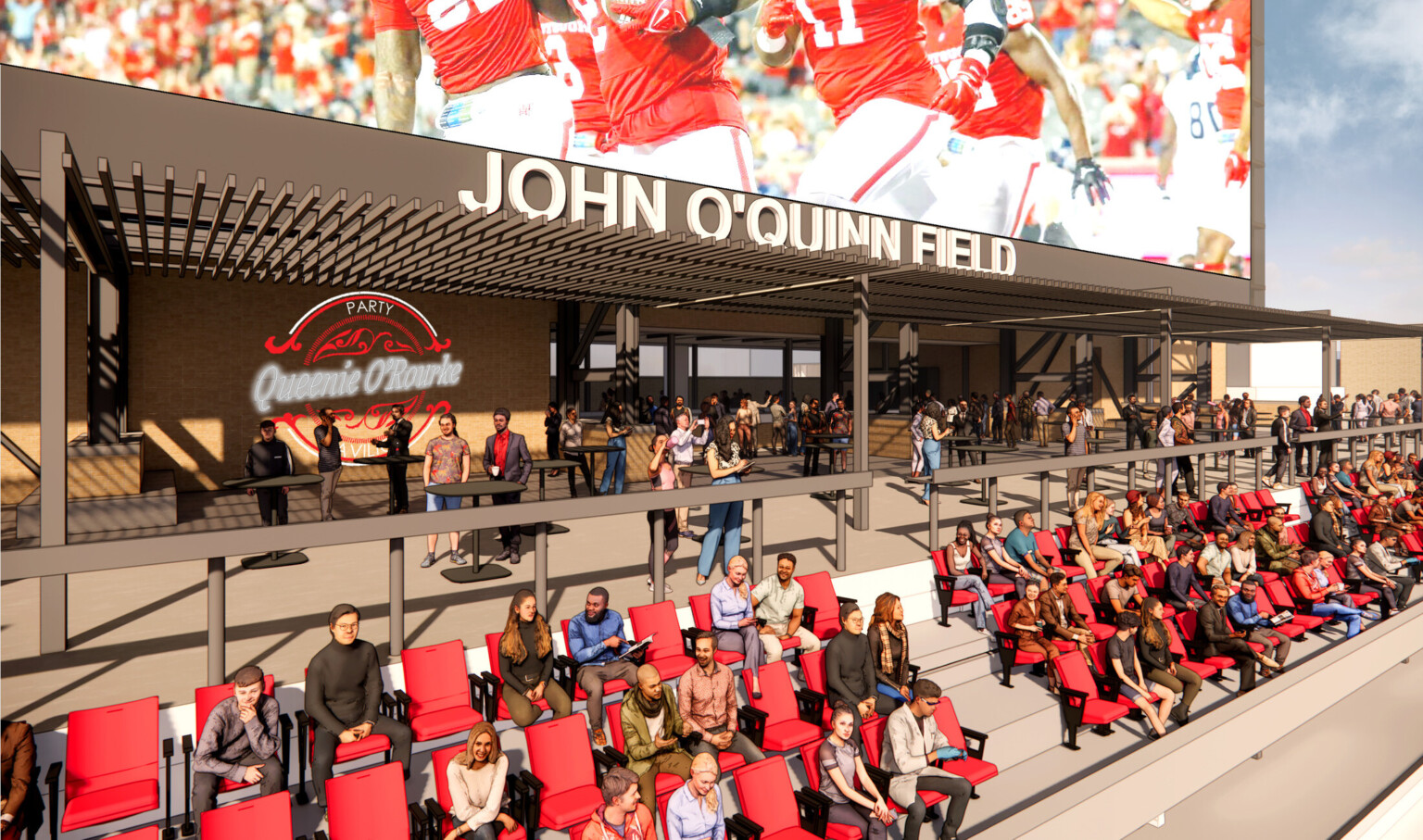 Outdoor patio with large screen, red seating filled with people with branding on the back walls