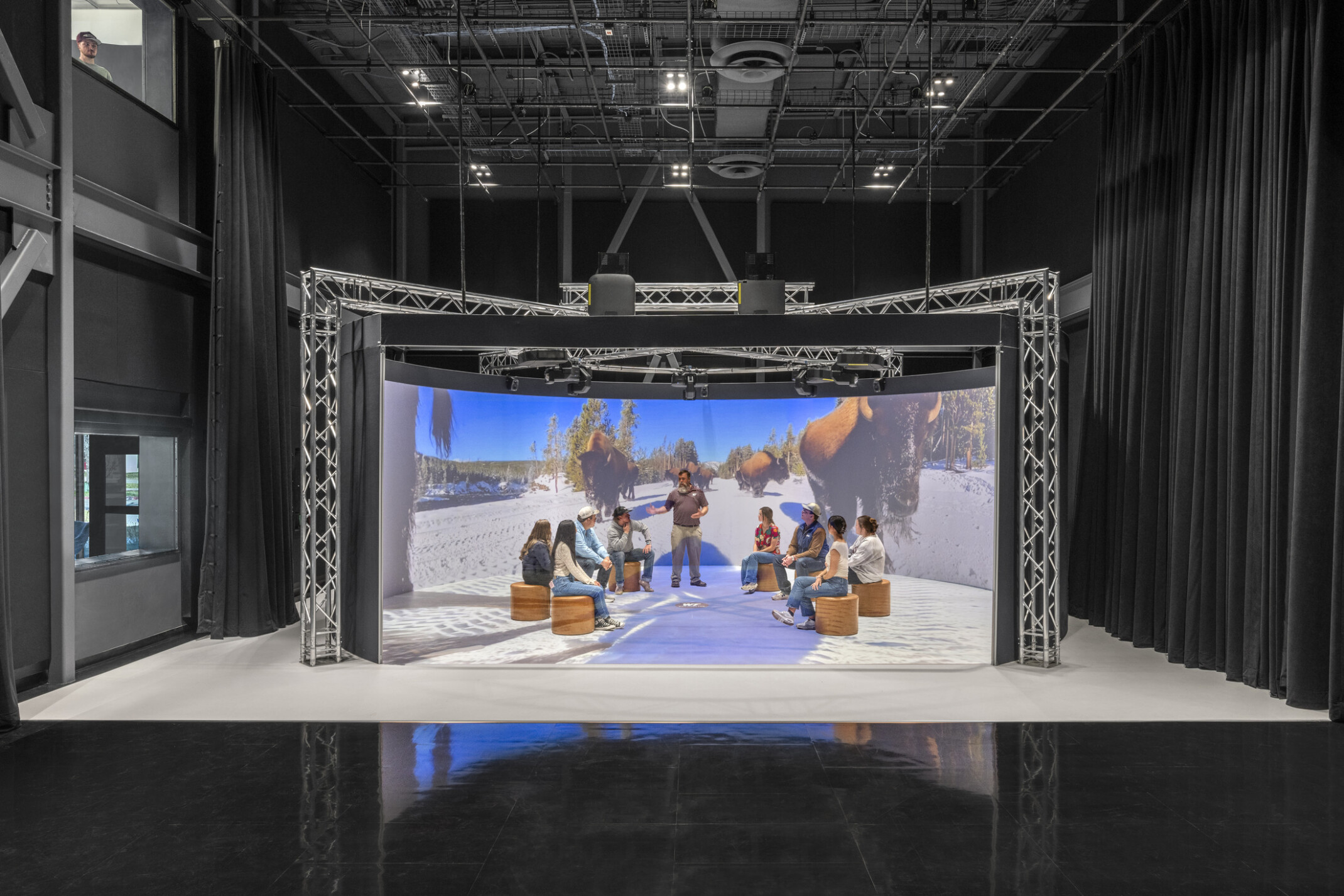 immersive stage area with people standing in a led alcove