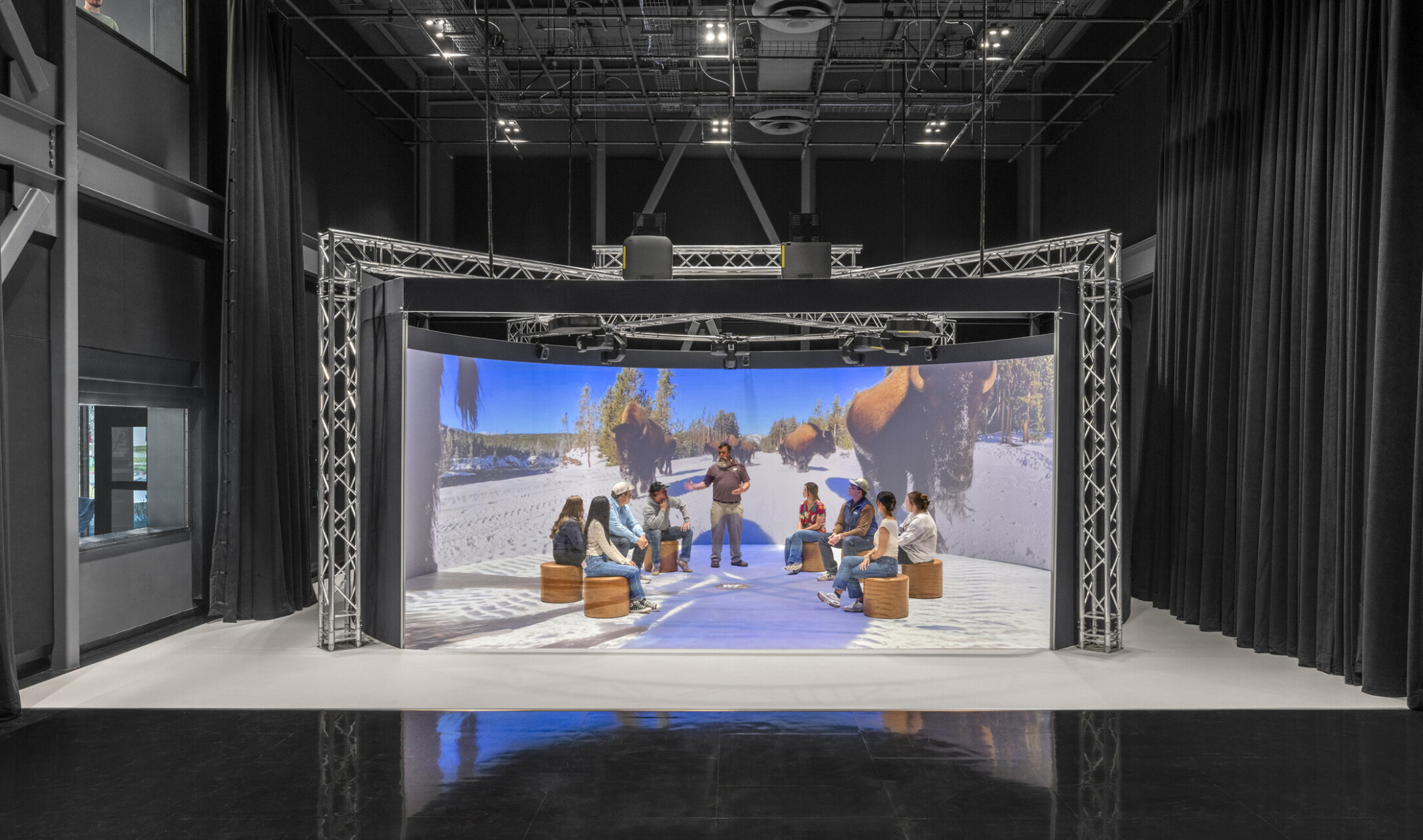 immersive stage area with people standing in a led alcove