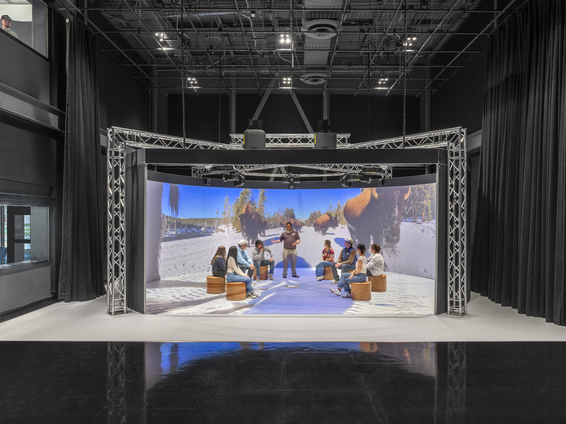 immersive stage area with people standing in a led alcove