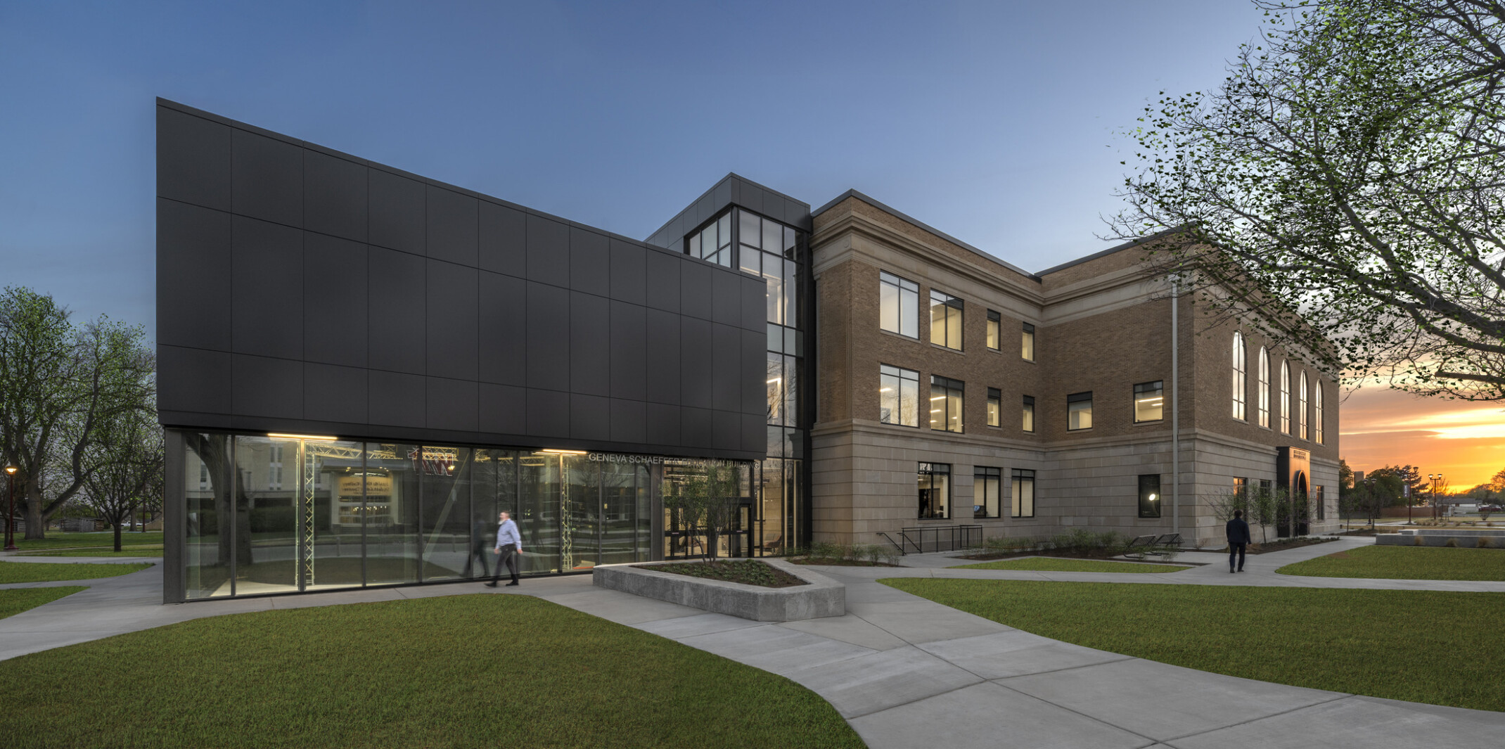 entrance to a historic university building; with a modern black box addition