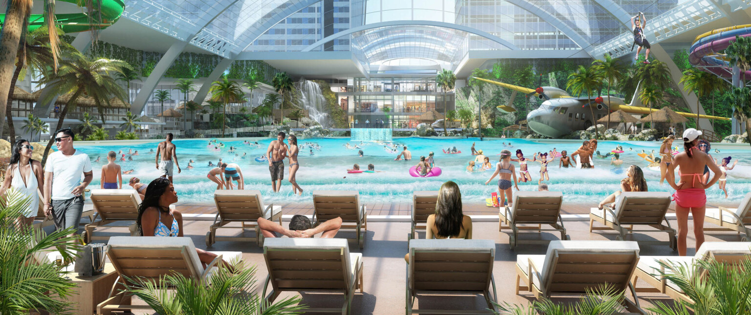 Rendering of waterpark interior. Lounge chairs sit in front of pool surrounded by plants with zipline and skylight overhead