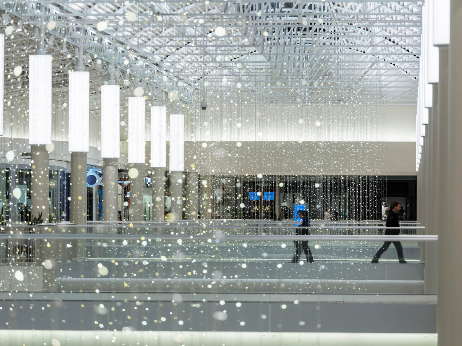 light filled walkways with exposed white beams