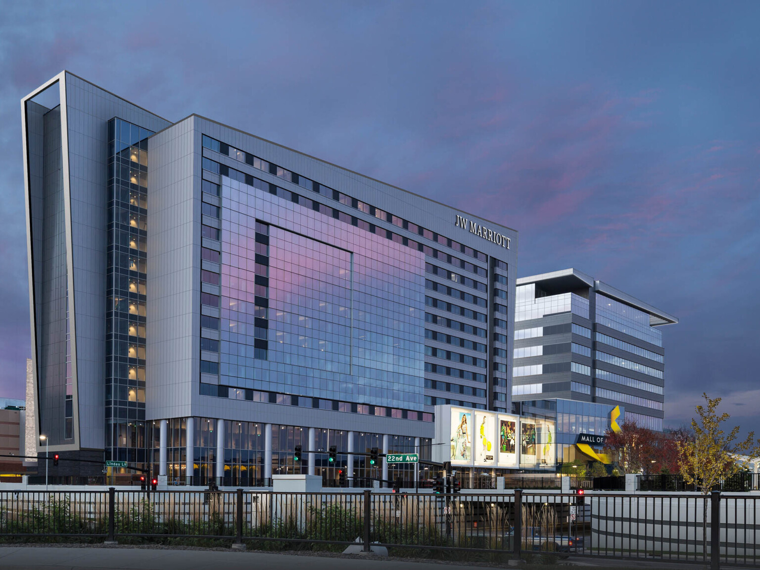 dusk view of mall of america with the glass facade reflecting the purple and blue sunset