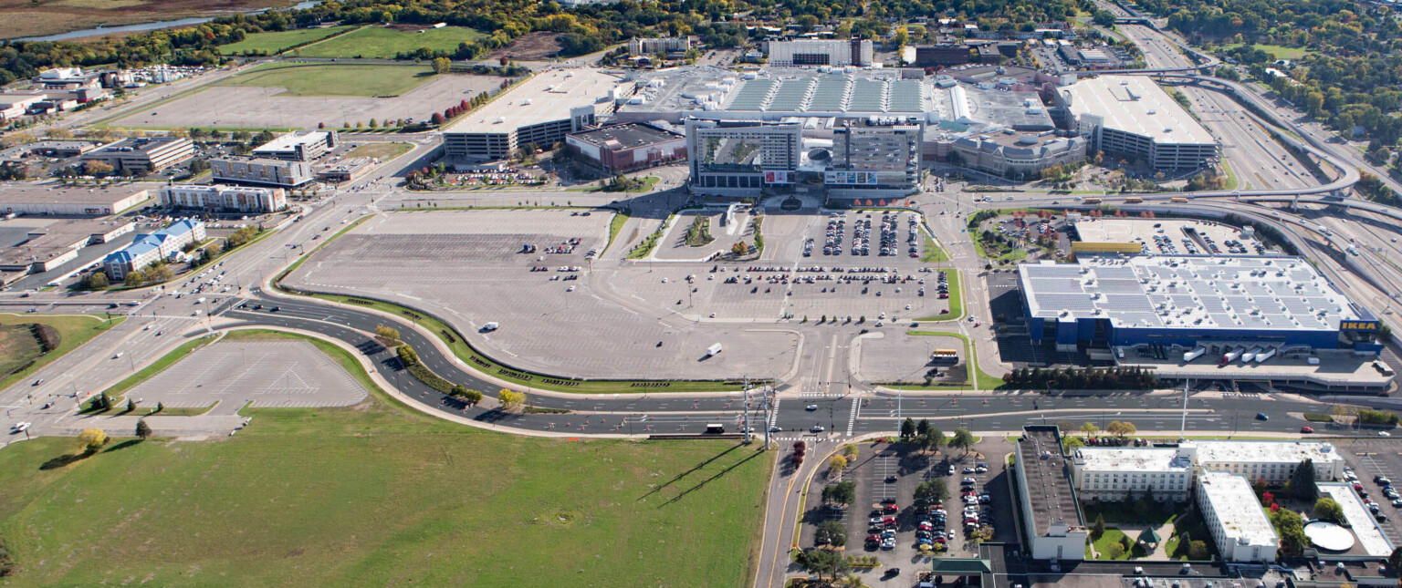 Aerial image of the Mall of America showing large buildings and parking lots filled with cars