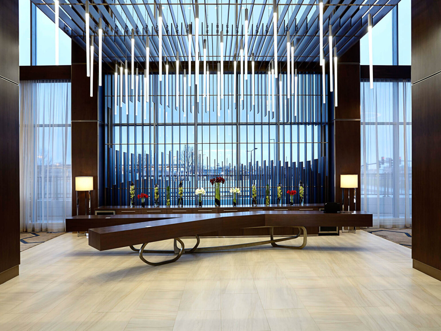 Hotel lobby area with modern seating and light suspended from the ceiling