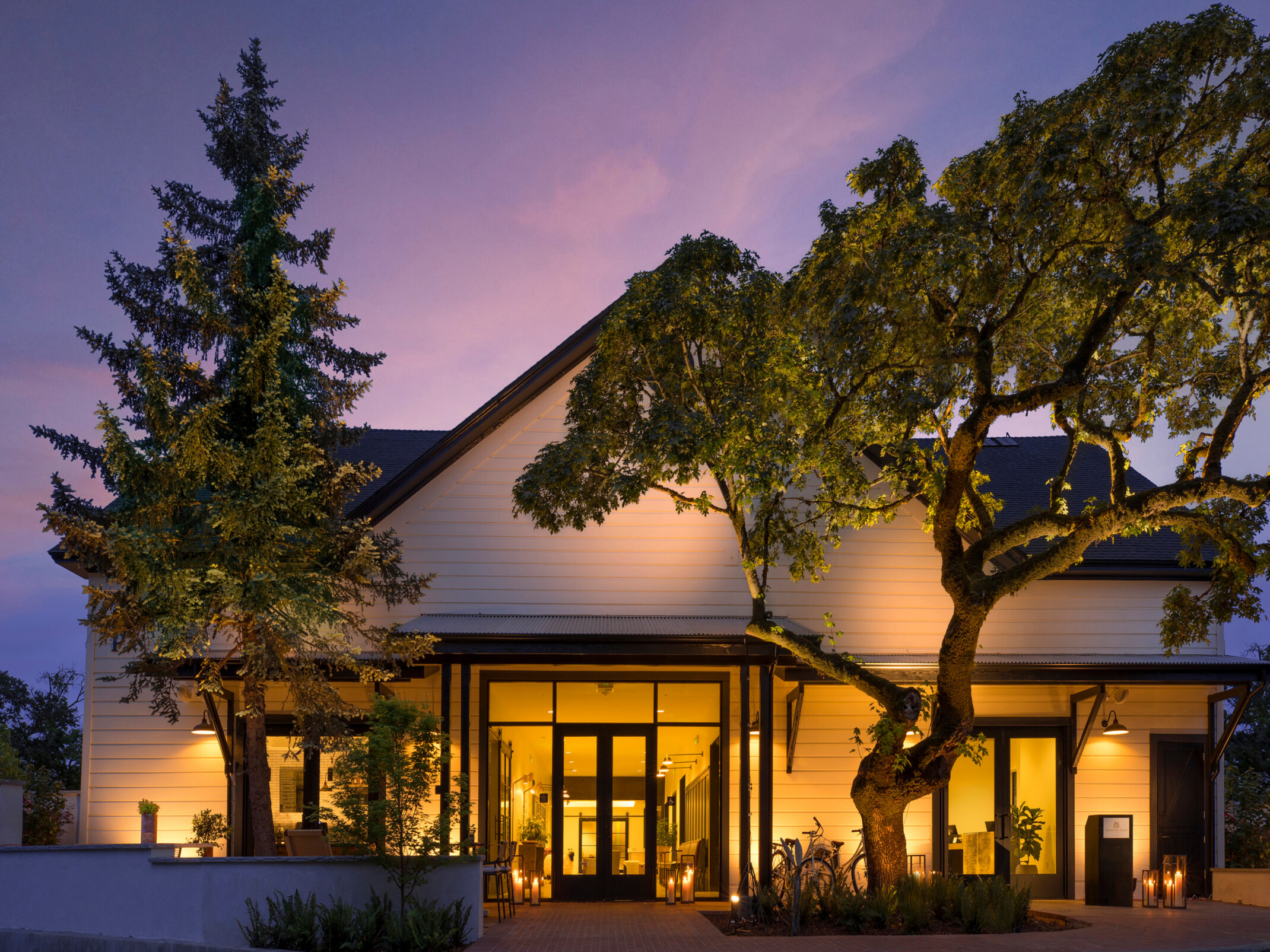 evening image of a cabin-like building front entrance