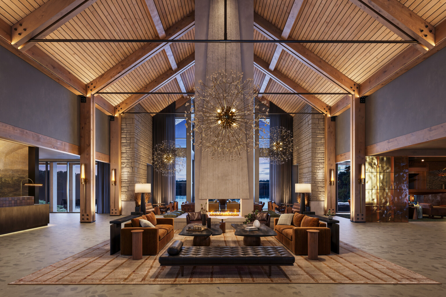 interior of a lodge-themed hotel lobby; rustic columns; stone walls; dark leather and wood interior tables and booths