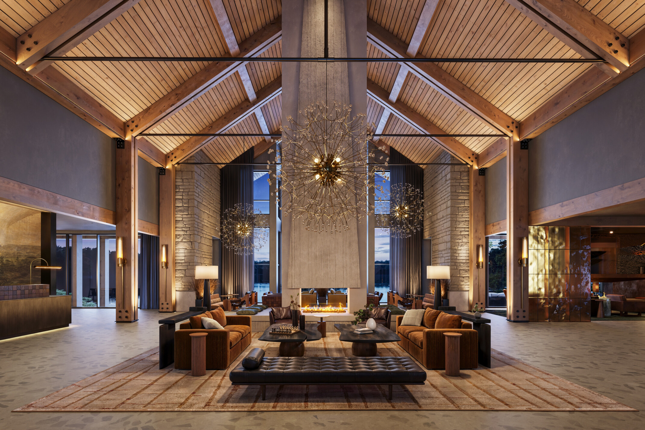 interior of a lodge-themed hotel lobby; rustic columns; stone walls; dark leather and wood interior tables and booths