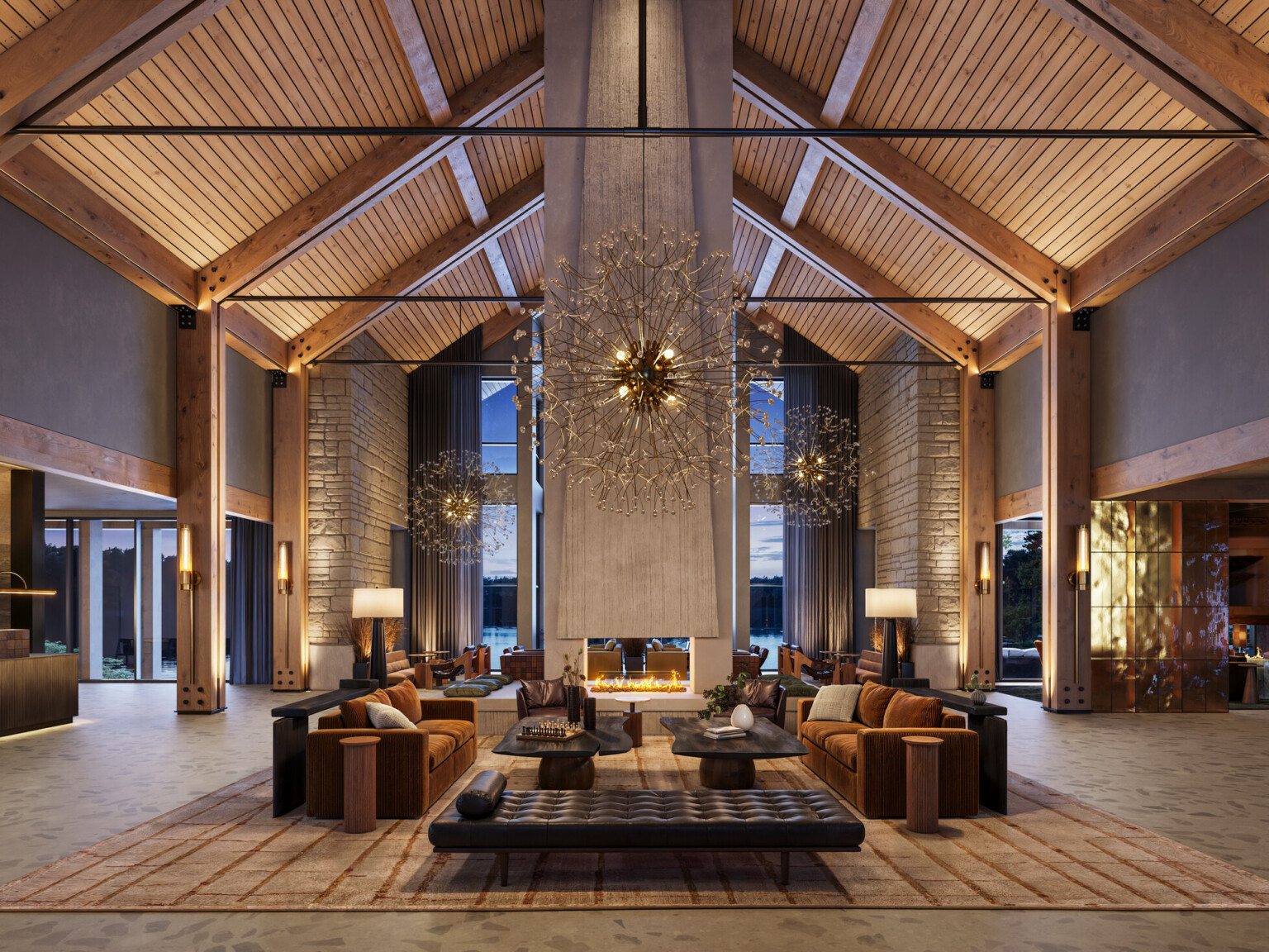 interior of a lodge-themed hotel lobby; rustic columns; stone walls; dark leather and wood interior tables and booths