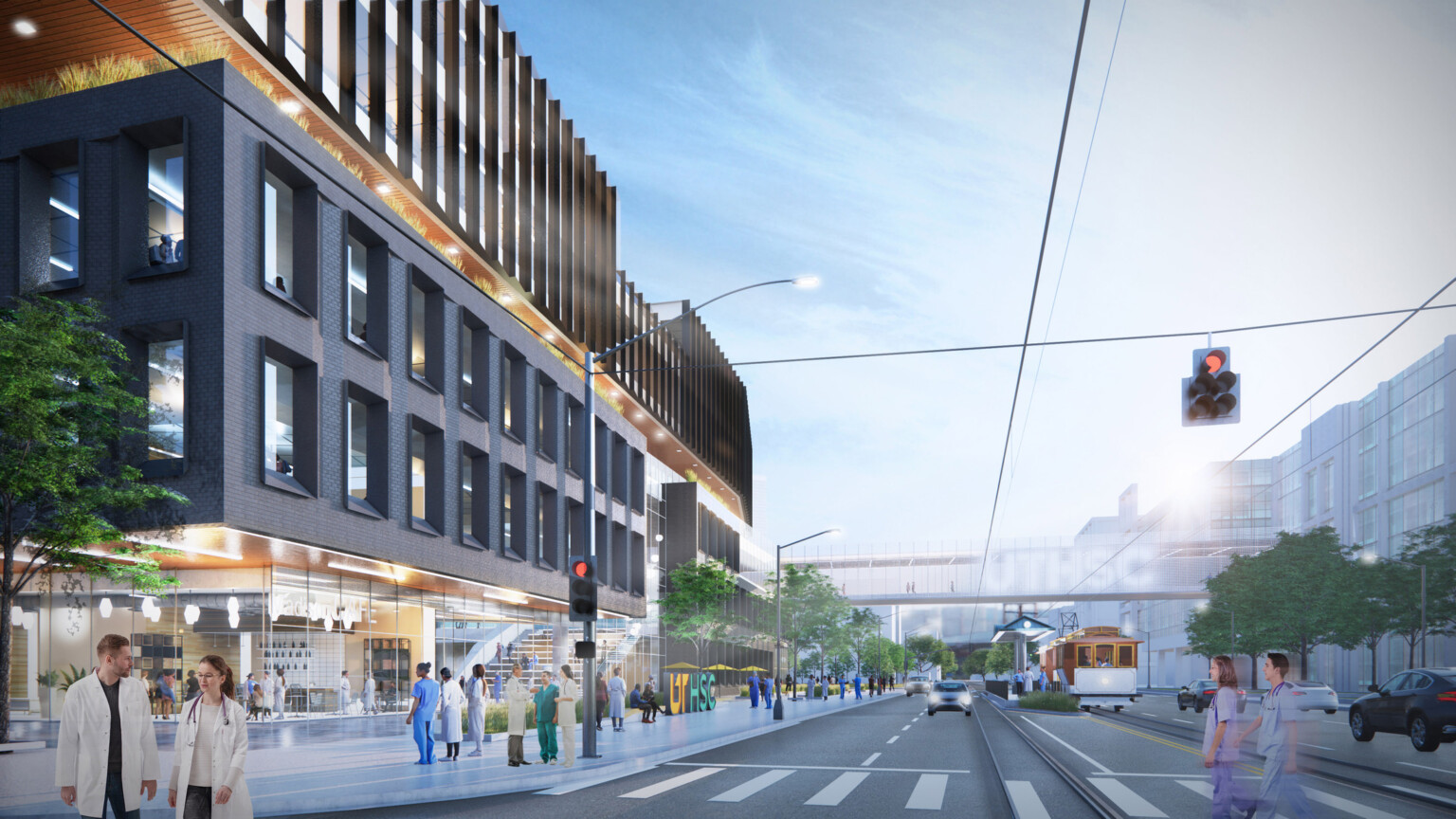 3rd story glass walkway connects black building with glass and wood accents over street traffic, large windows