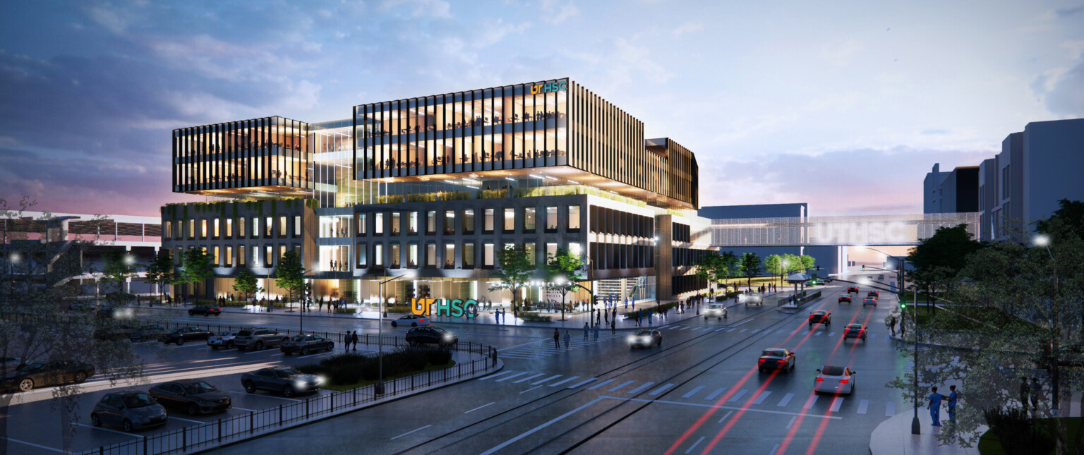 New Medicine building front entrance, large building at intersection with windows, glass facade