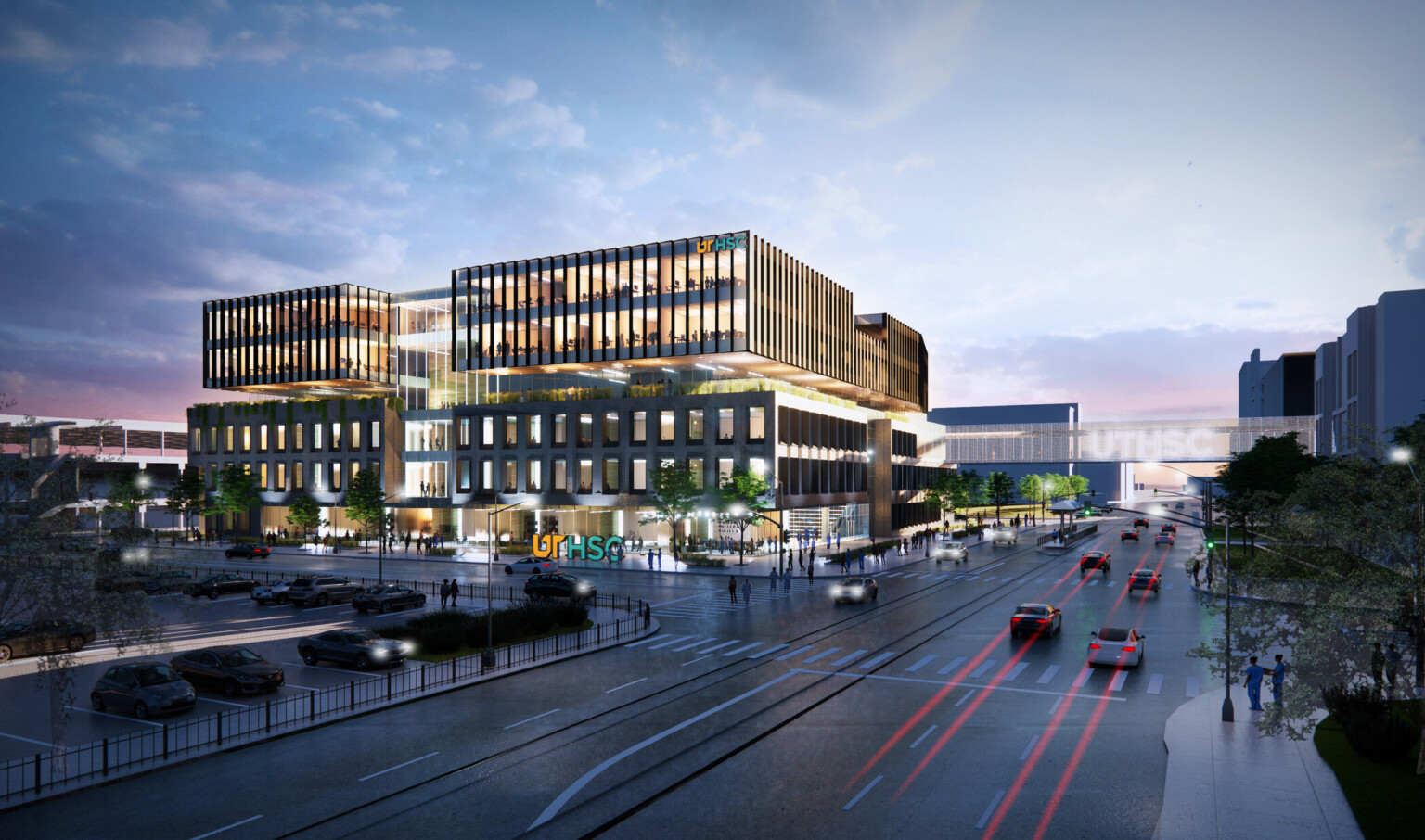 New Medicine building front entrance, large building at intersection with windows, glass facade