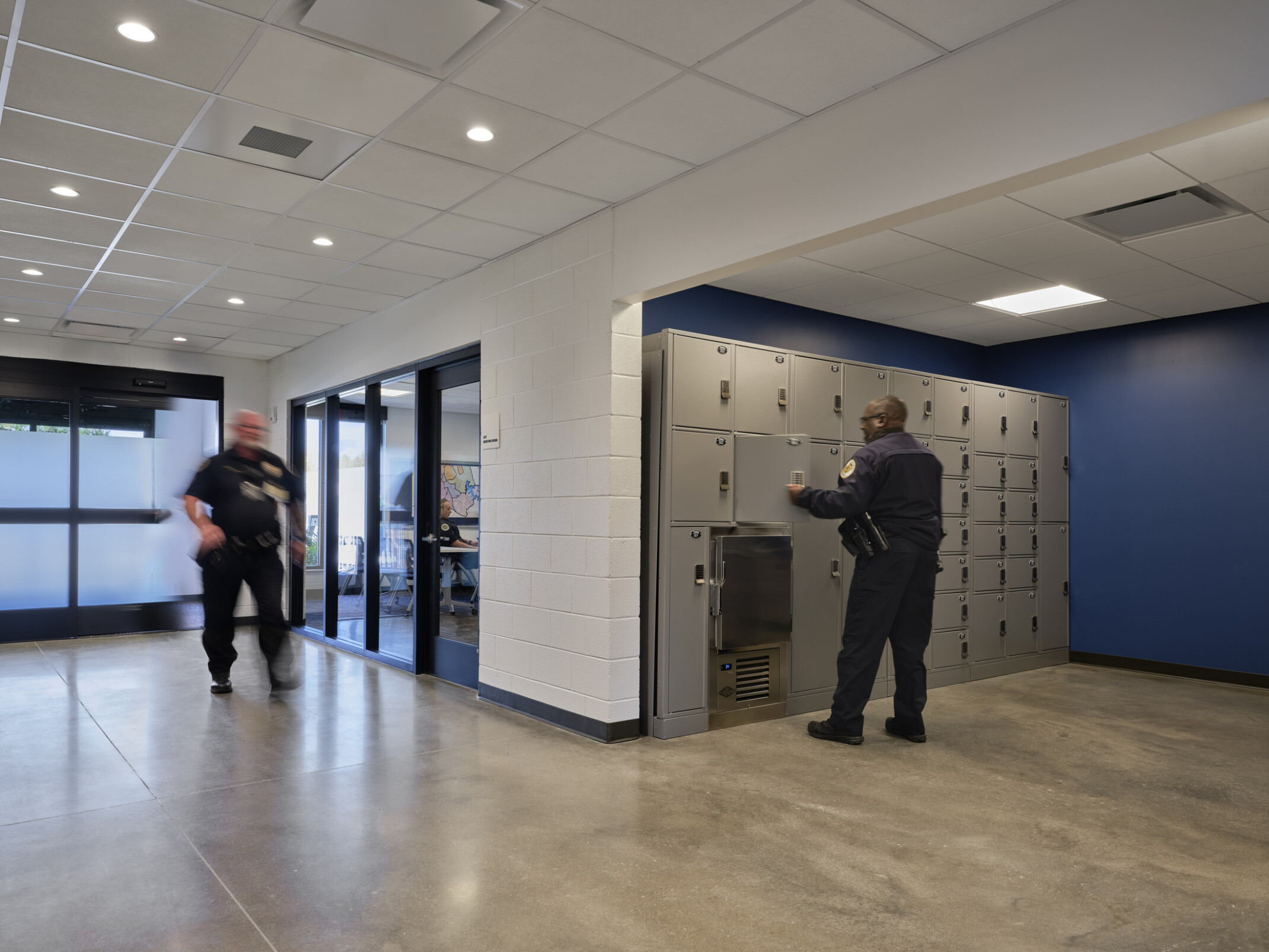 entry hallway to a police precinct; Staff entry with duty bag lockers