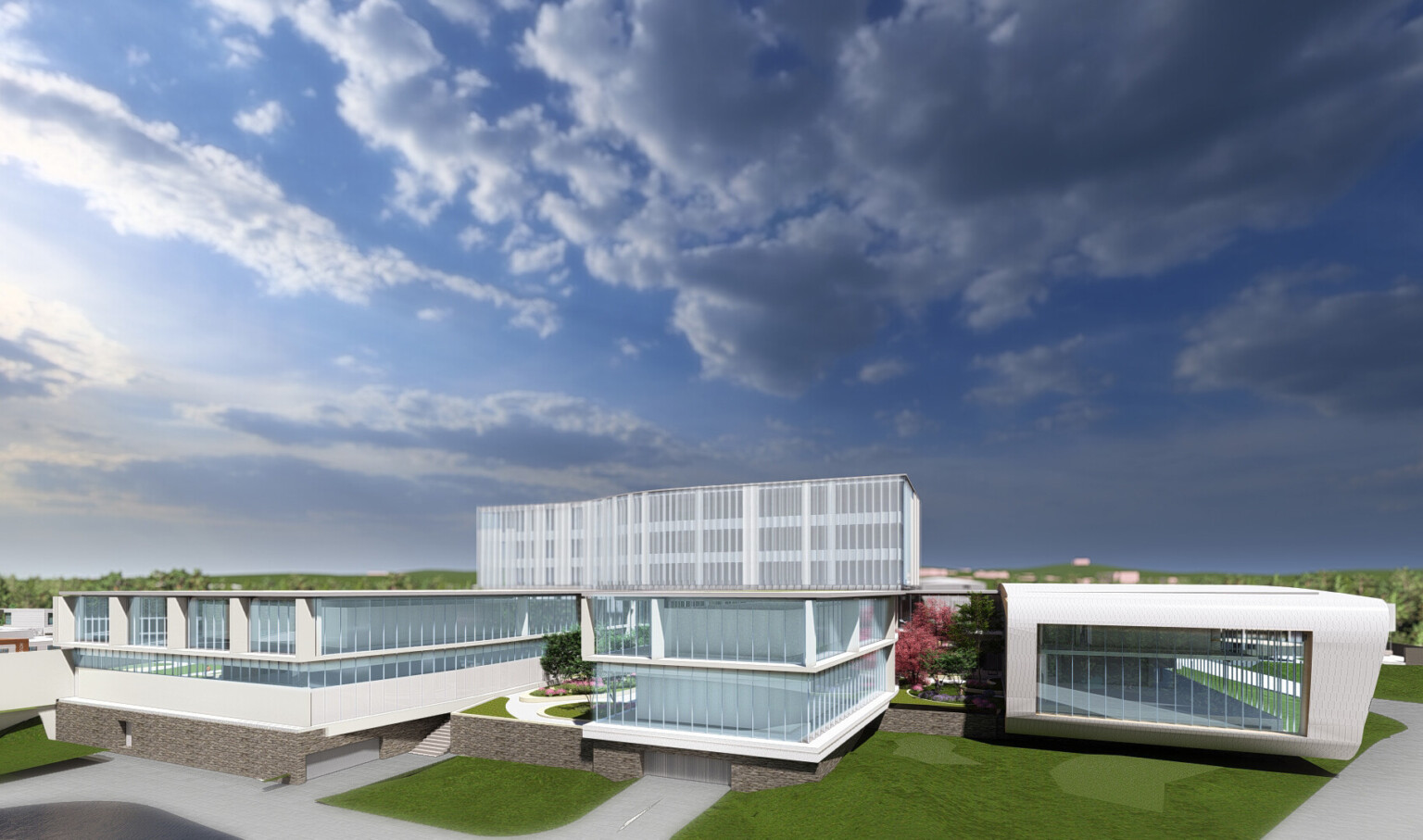 Long building on green lawn with large windows and white wrap facade