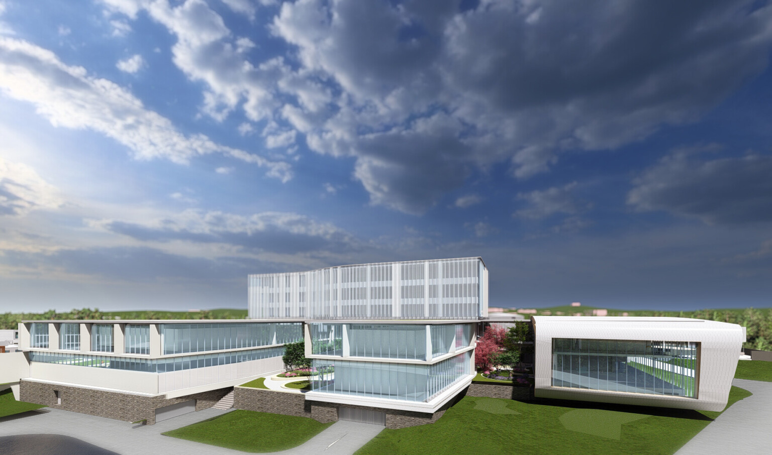 Long building on green lawn with large windows and white wrap facade