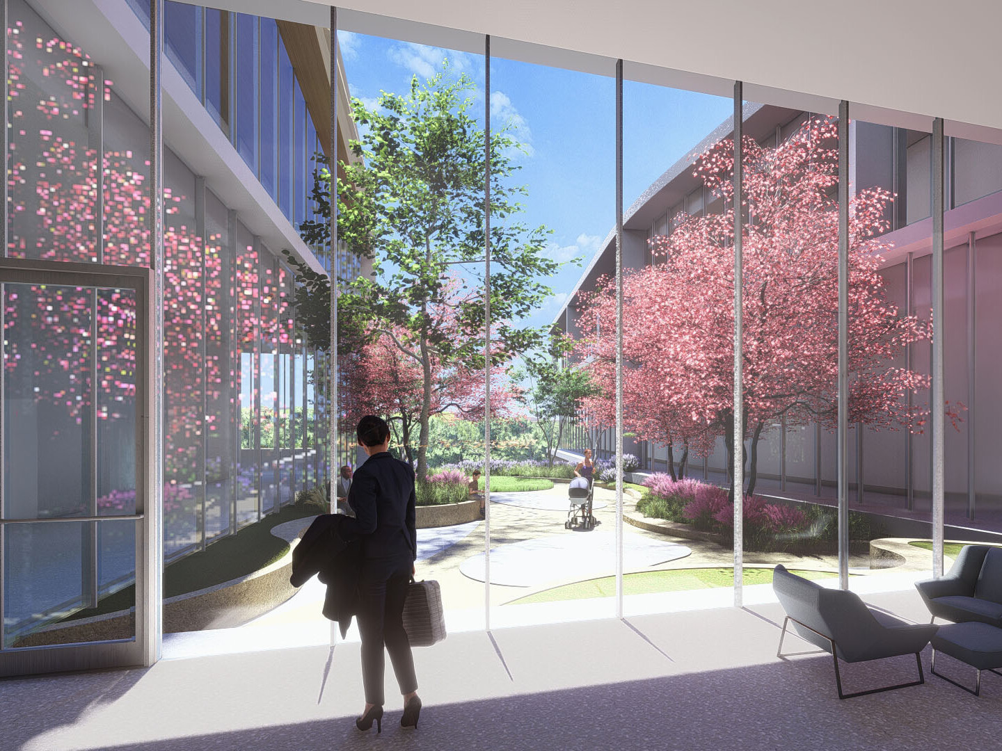 Interior view to courtyard, floor to ceiling windows look to blooming trees