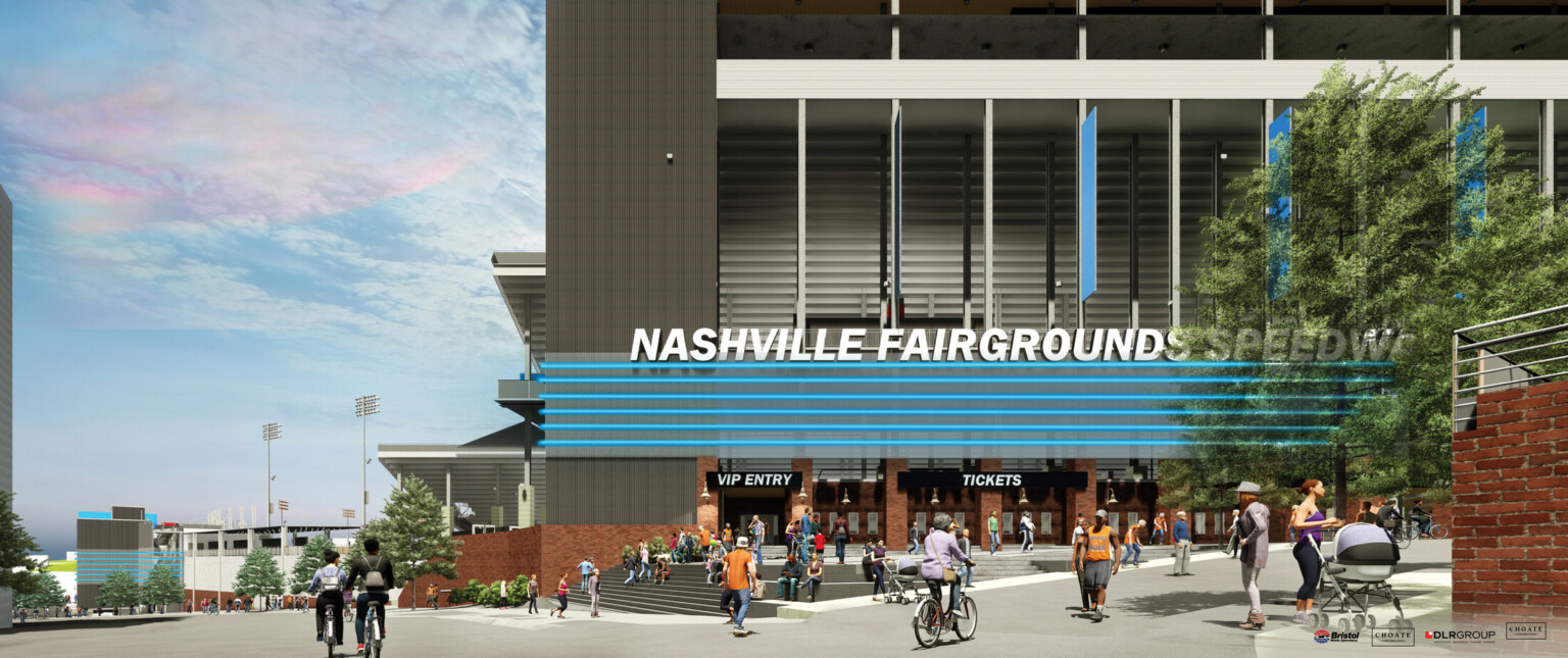 Pedestrian friendly walkway with steps and ramp leading to black building with blue accent, sign reads Nashville Fairgrounds Speedway