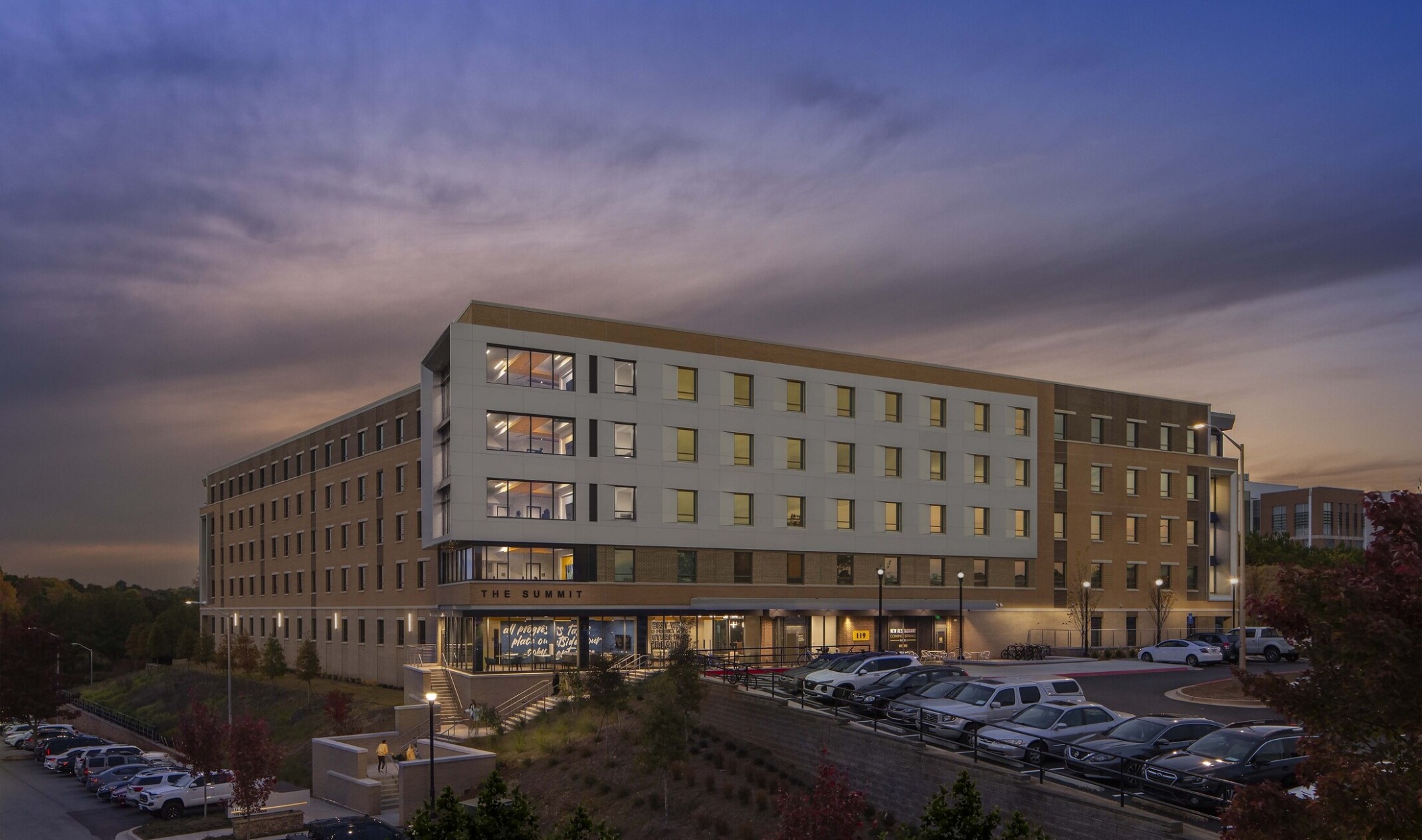 evening image of a large building called 