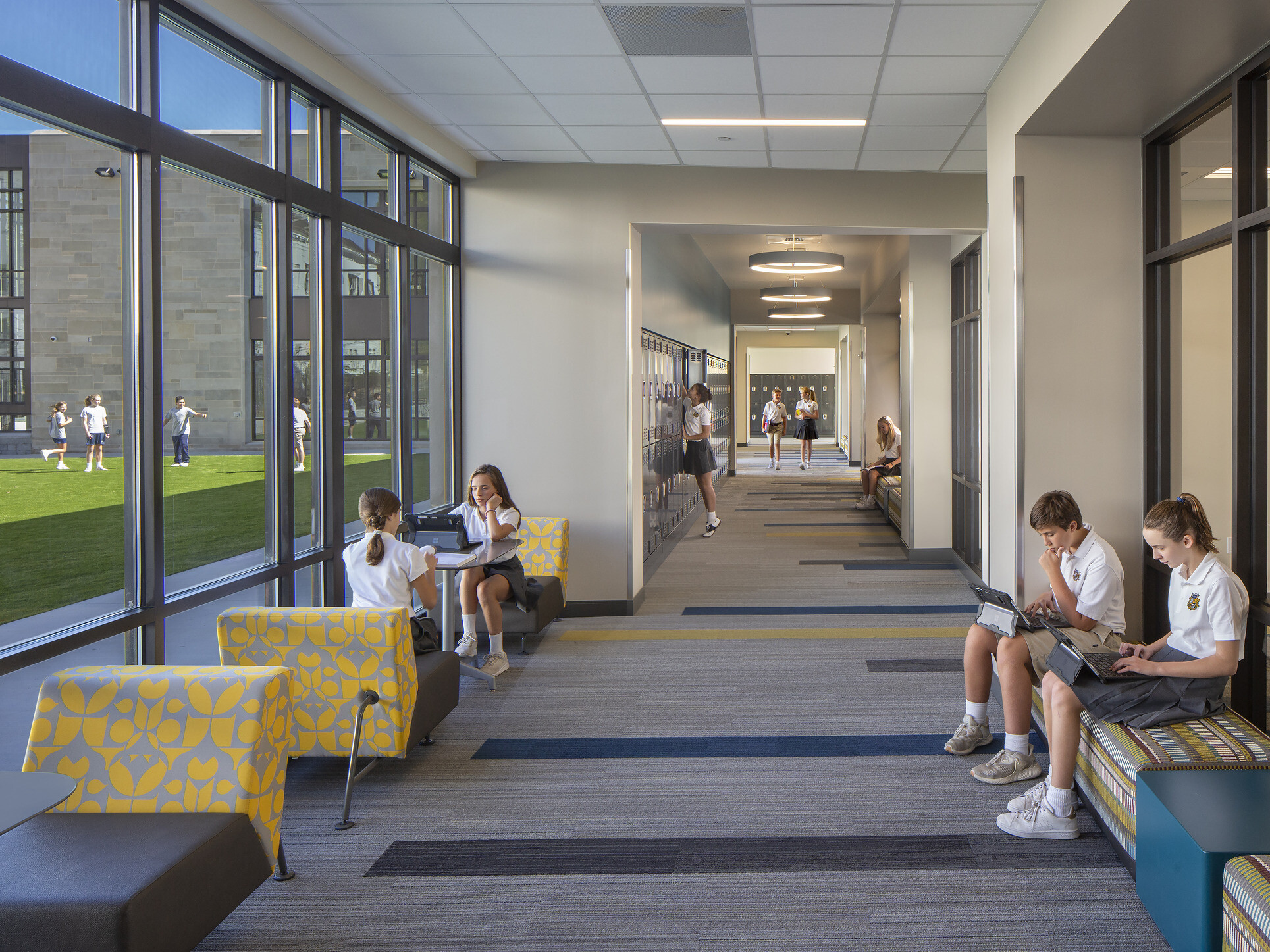 modern school hallway with modular furniture for students to sit and work