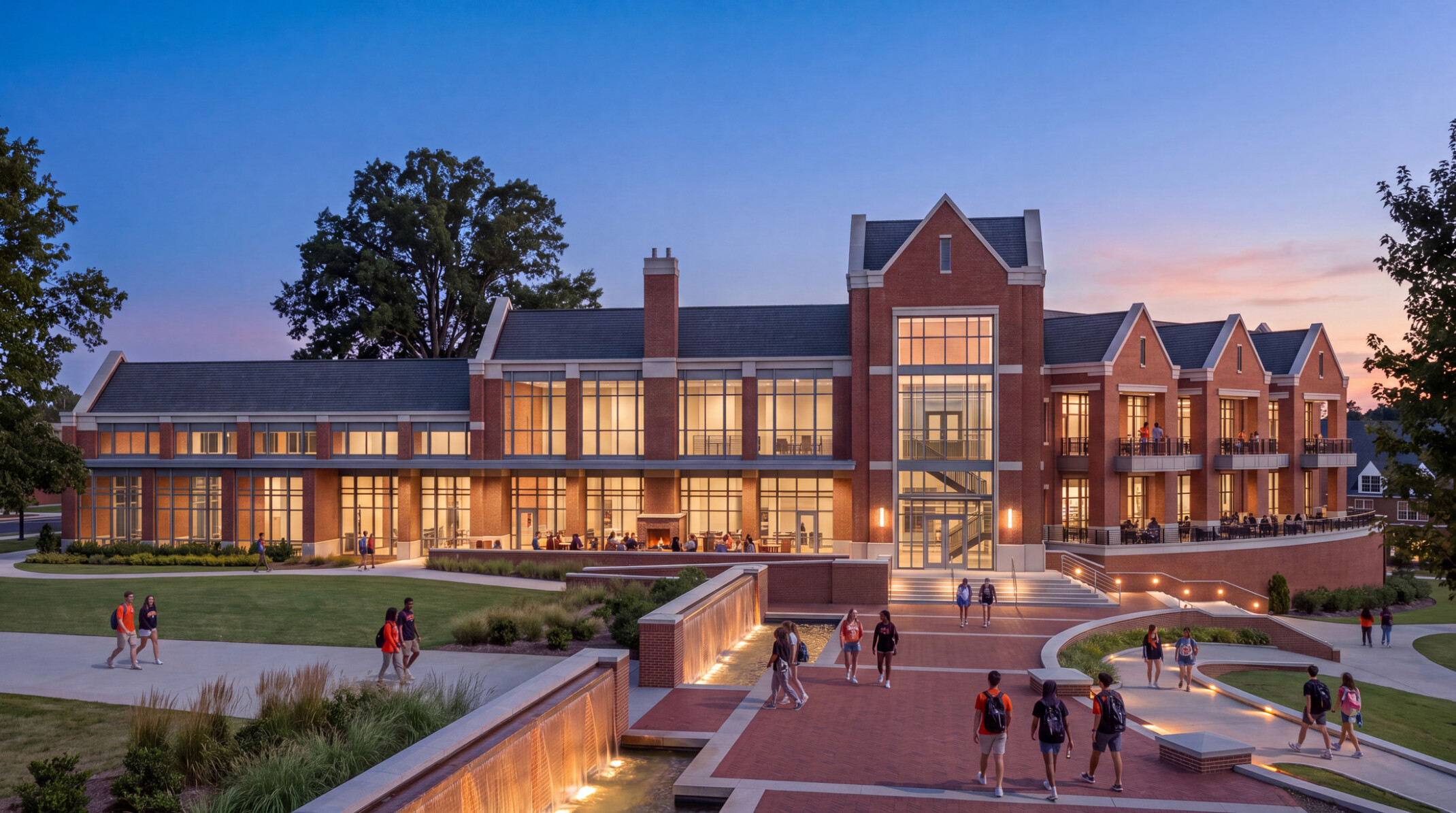 University building with multi-paneled facade with pointed roofing; foreground large campus walkway in the evening