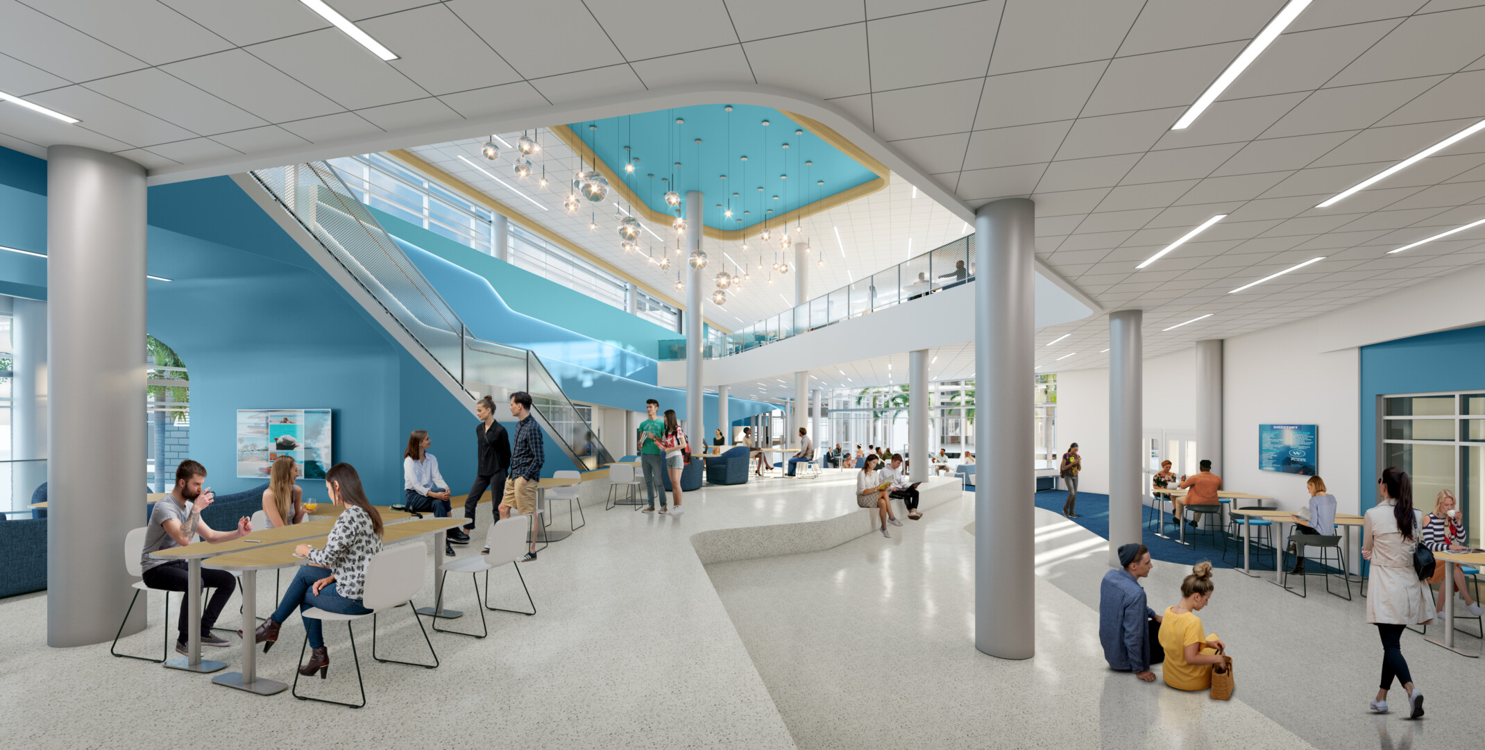 Modern high school common area filled with people sitting at tables in multiple seating arrangements around the space