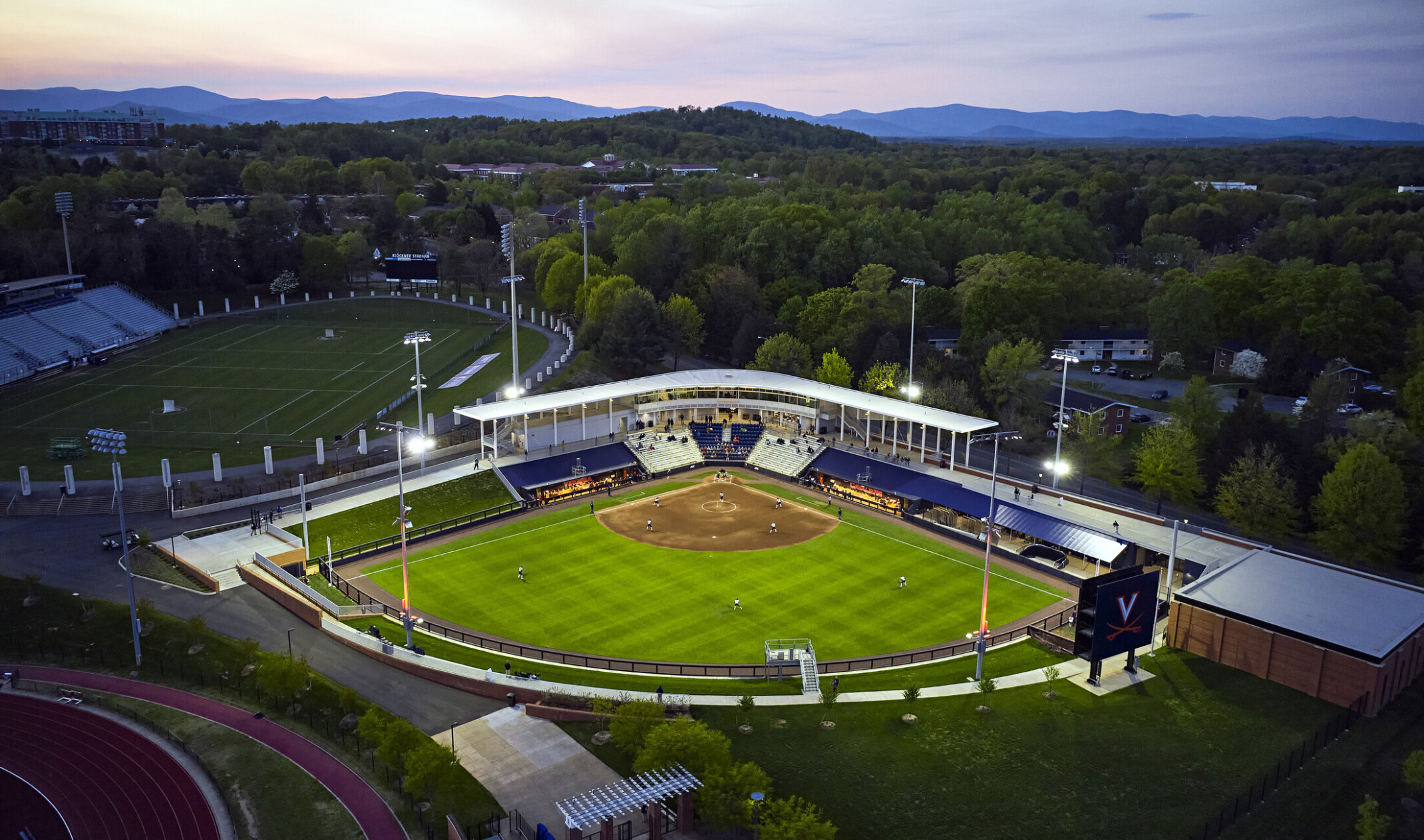 Palmer Park baseball stadium at the University of Virginia aerial view. Blue and white bleachers and mural on dugout visible