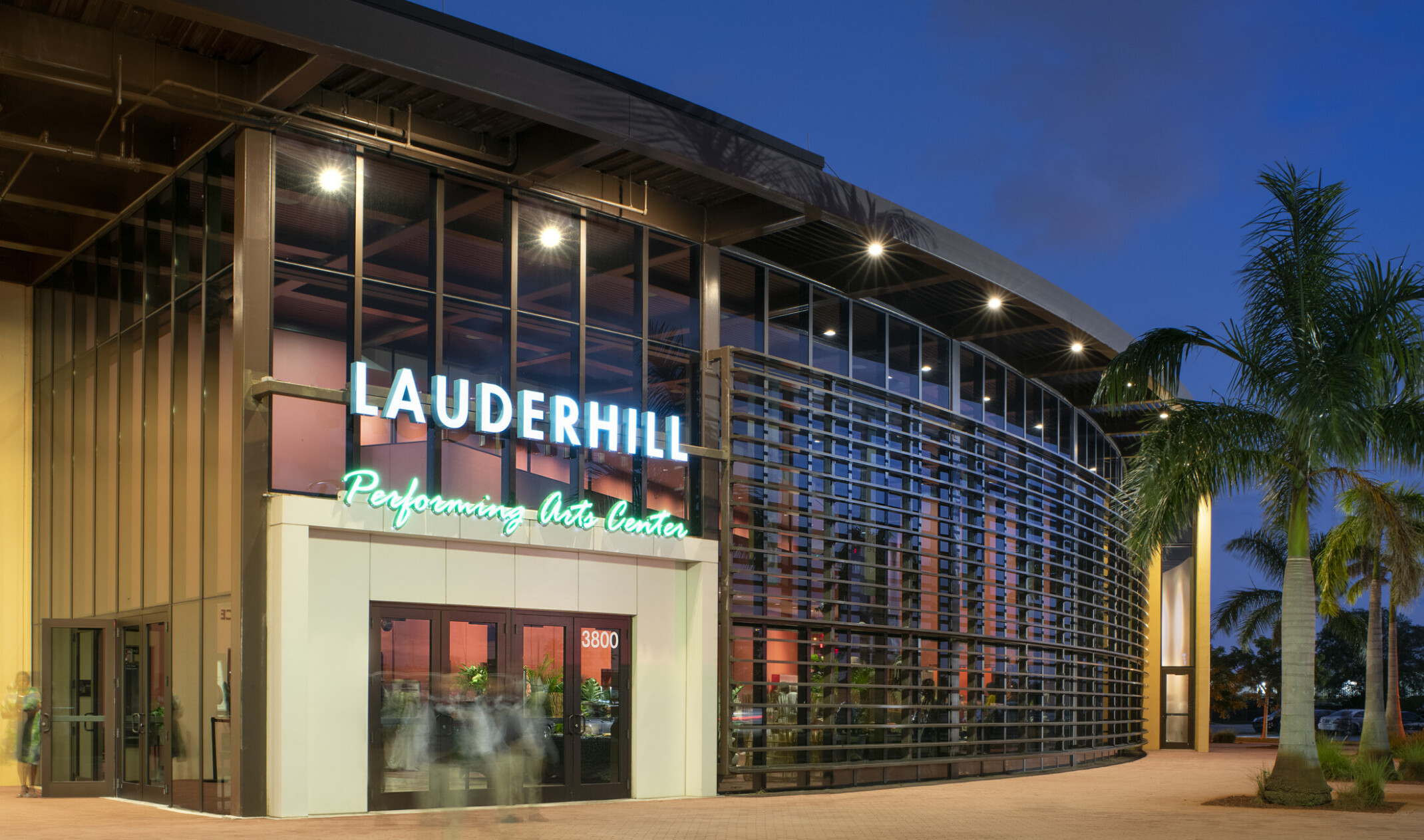 front entrance of the Lauderhill Performing Arts Center; rounded facade with floor to ceiling windows; LED building sinage