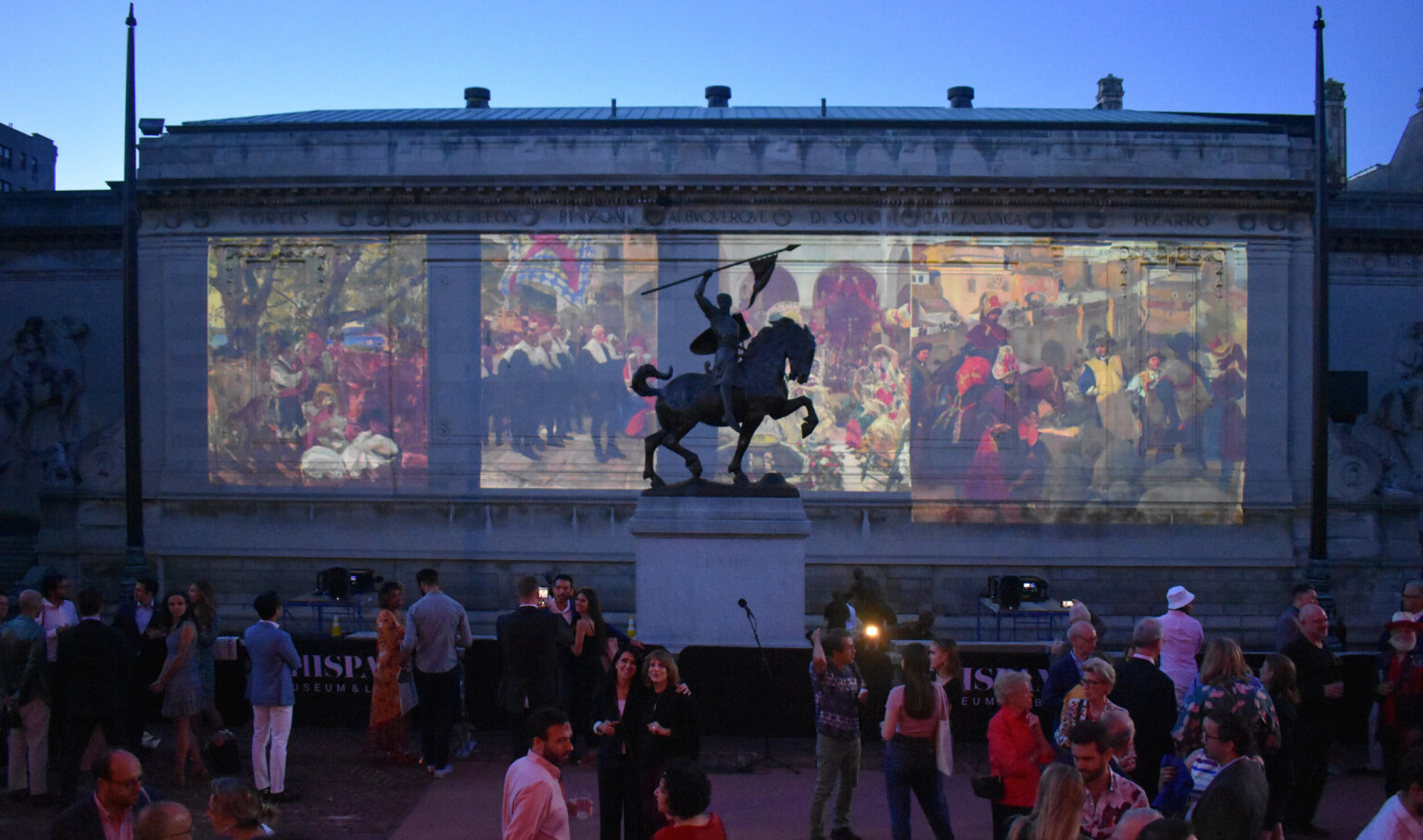 The Hispanic Society of New York, paintings projected on the side of the building beyond a sculpture of a man on horseback