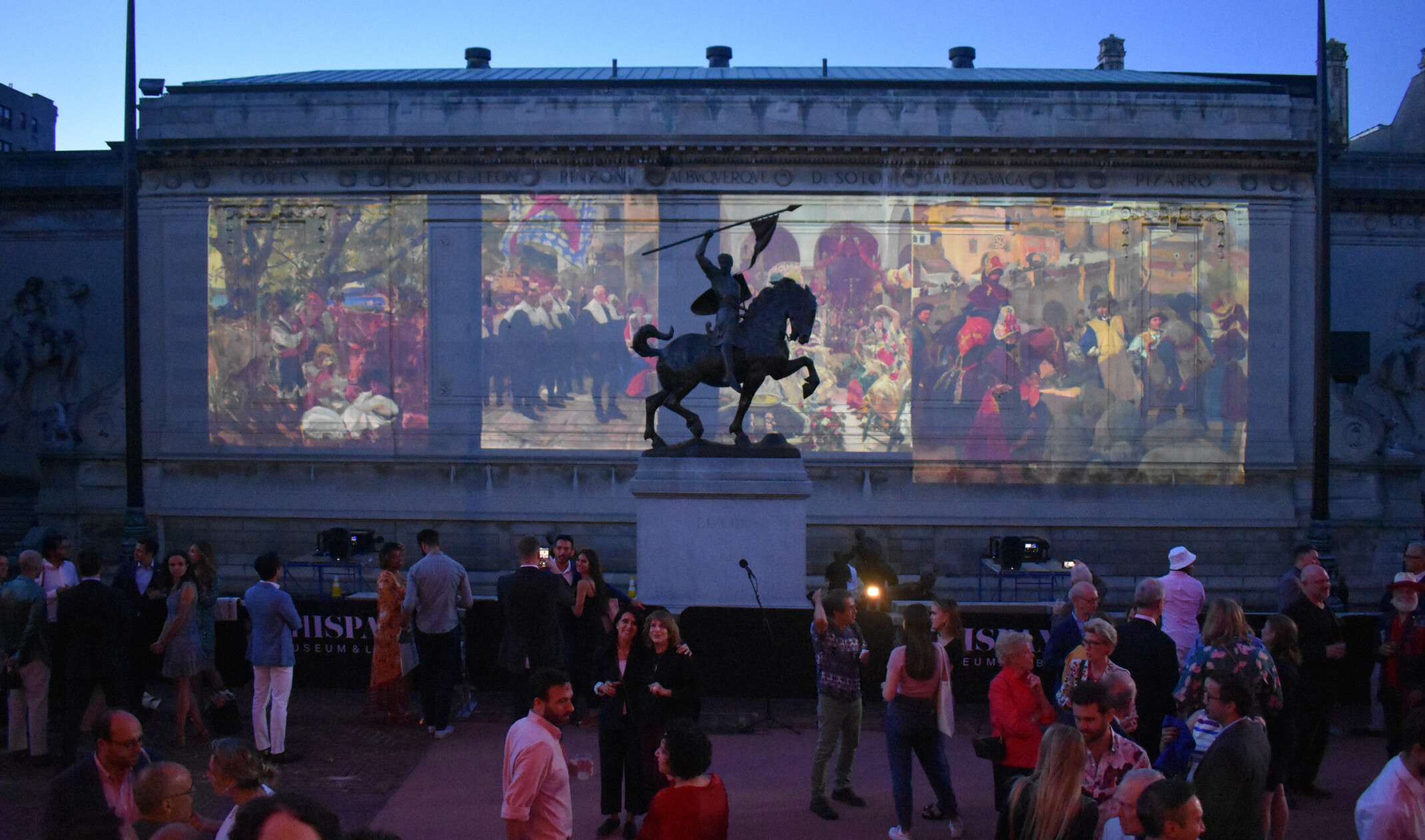The Hispanic Society of New York, paintings projected on the side of the building beyond a sculpture of a man on horseback