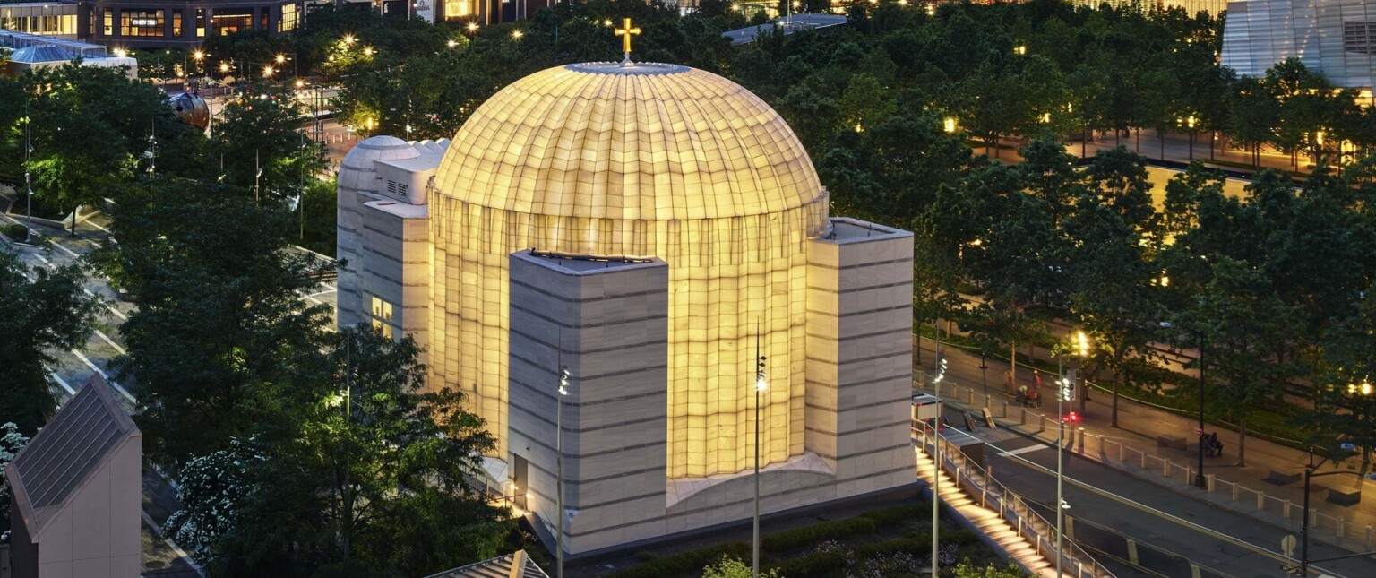 Exterior of the Greek Orthodox Church NYC showing the ambient glow of light