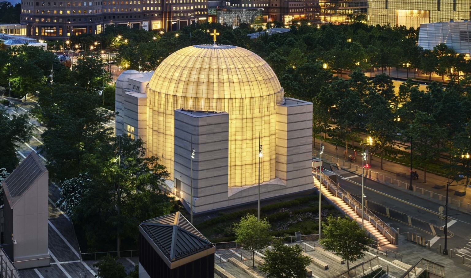 Exterior of the Saint Nicholas Greek Orthodox Church in New York City featuring the ambient glow of light Exterior of the Saint Nicholas Greek Orthodox Church in New York City featuring the ambient glow of light