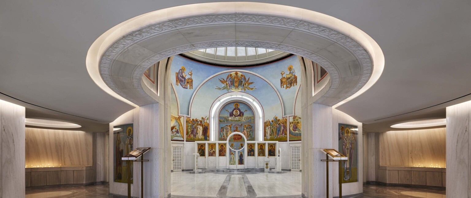 Interior view of the Saint Nicholas Greek Orthodox Church in New York City showcasing lighting and intricate painting