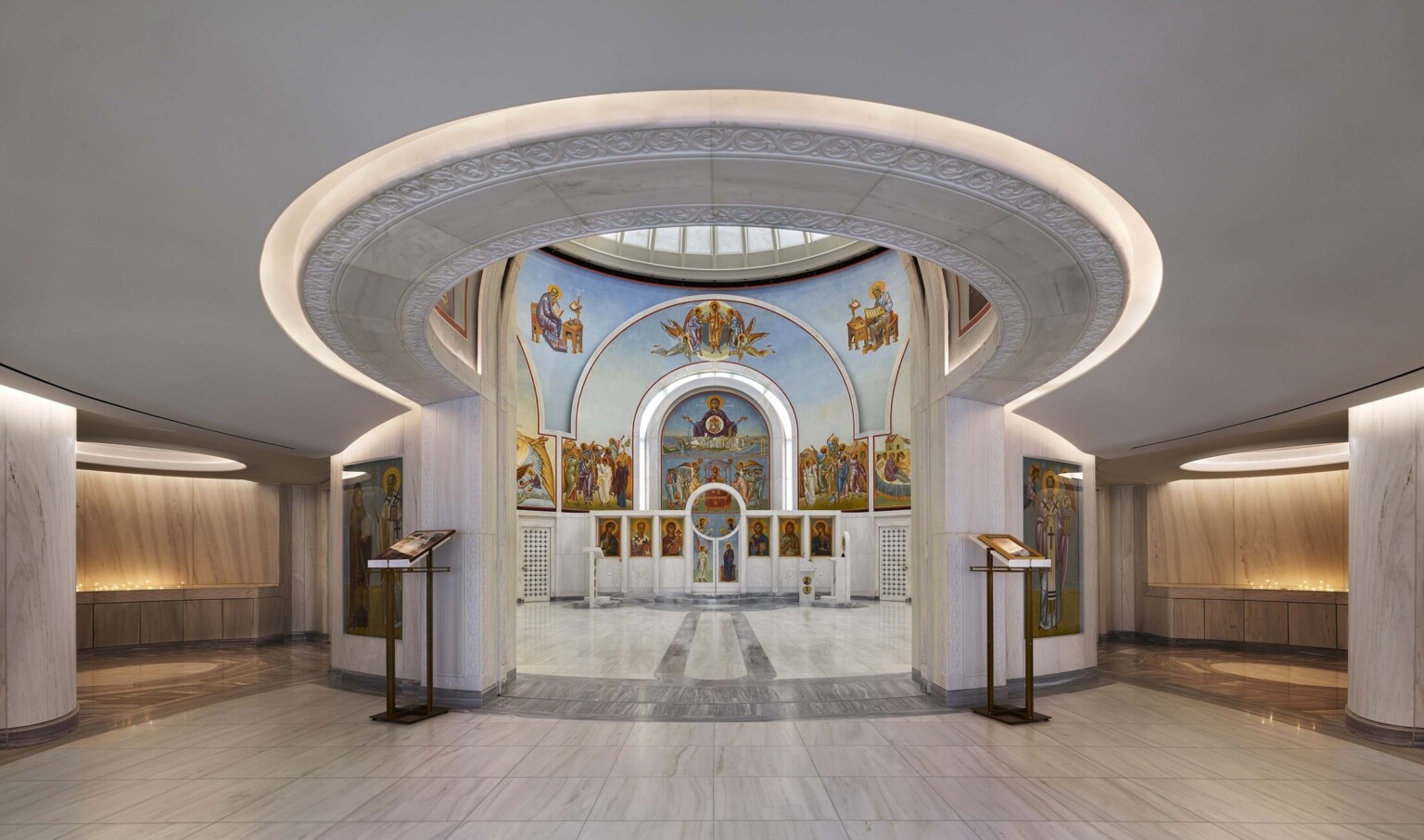 Interior view of the Saint Nicholas Greek Orthodox Church in New York City showcasing lighting and intricate painting
