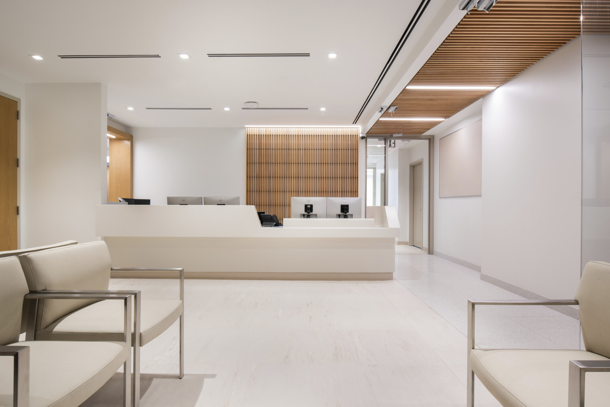 reception area for Mt. Sinai cardiology, soothing cream colors for walls, flooring and ceiling, skylights provide a serene connection to nature, two primary wayfinding devices – exterior windows along the corridor and natural wood - help patients understand their current location and how to navigate to their destination reception area for Mt. Sinai cardiology, soothing cream colors for walls, flooring and ceiling, skylights provide a serene connection to nature, two primary wayfinding devices – exterior windows along the corridor and natural wood - help patients understand their current location and how to navigate to their destination