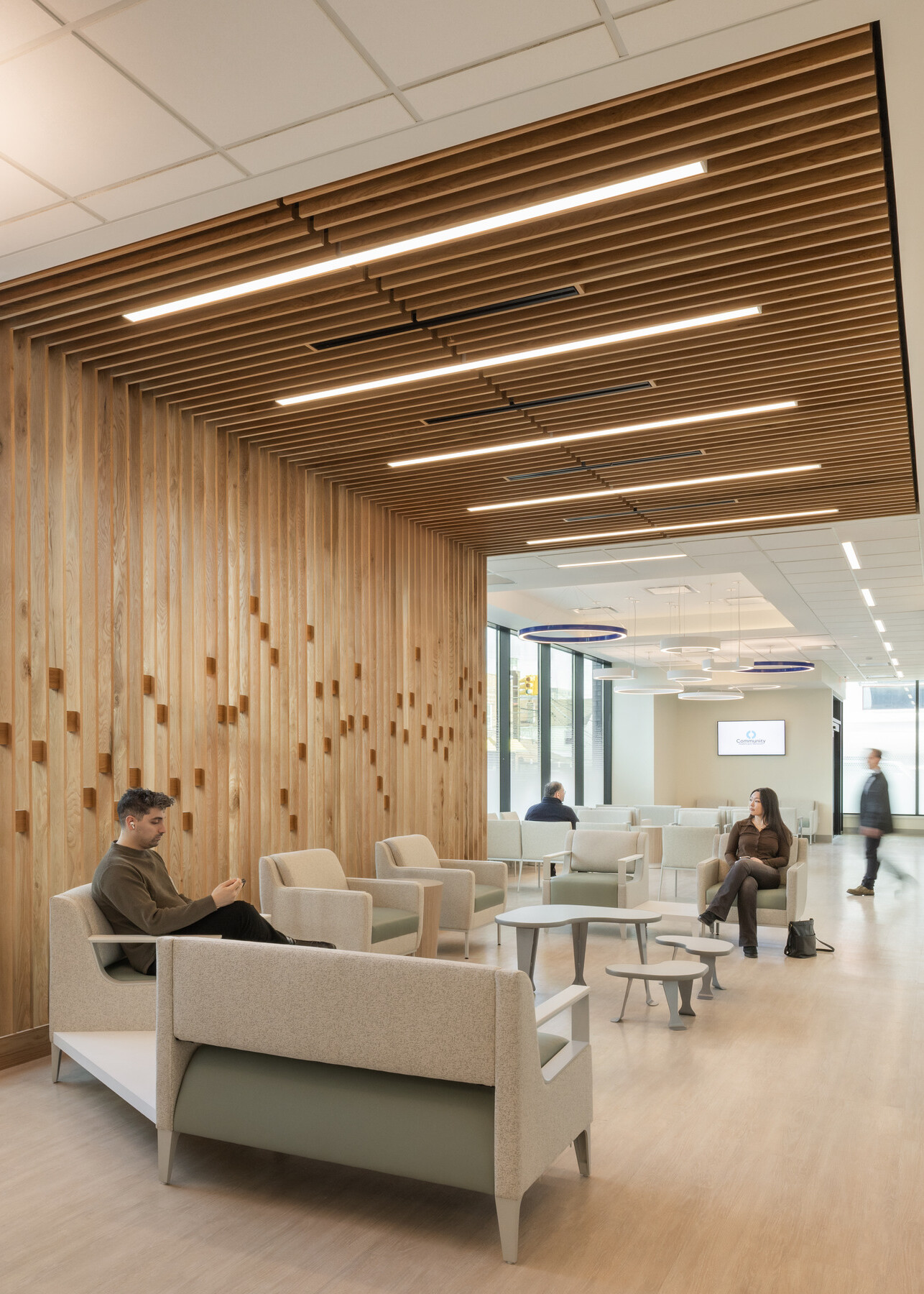 modern, light medical waiting room; hospitality inspired design with light wood and natural colors