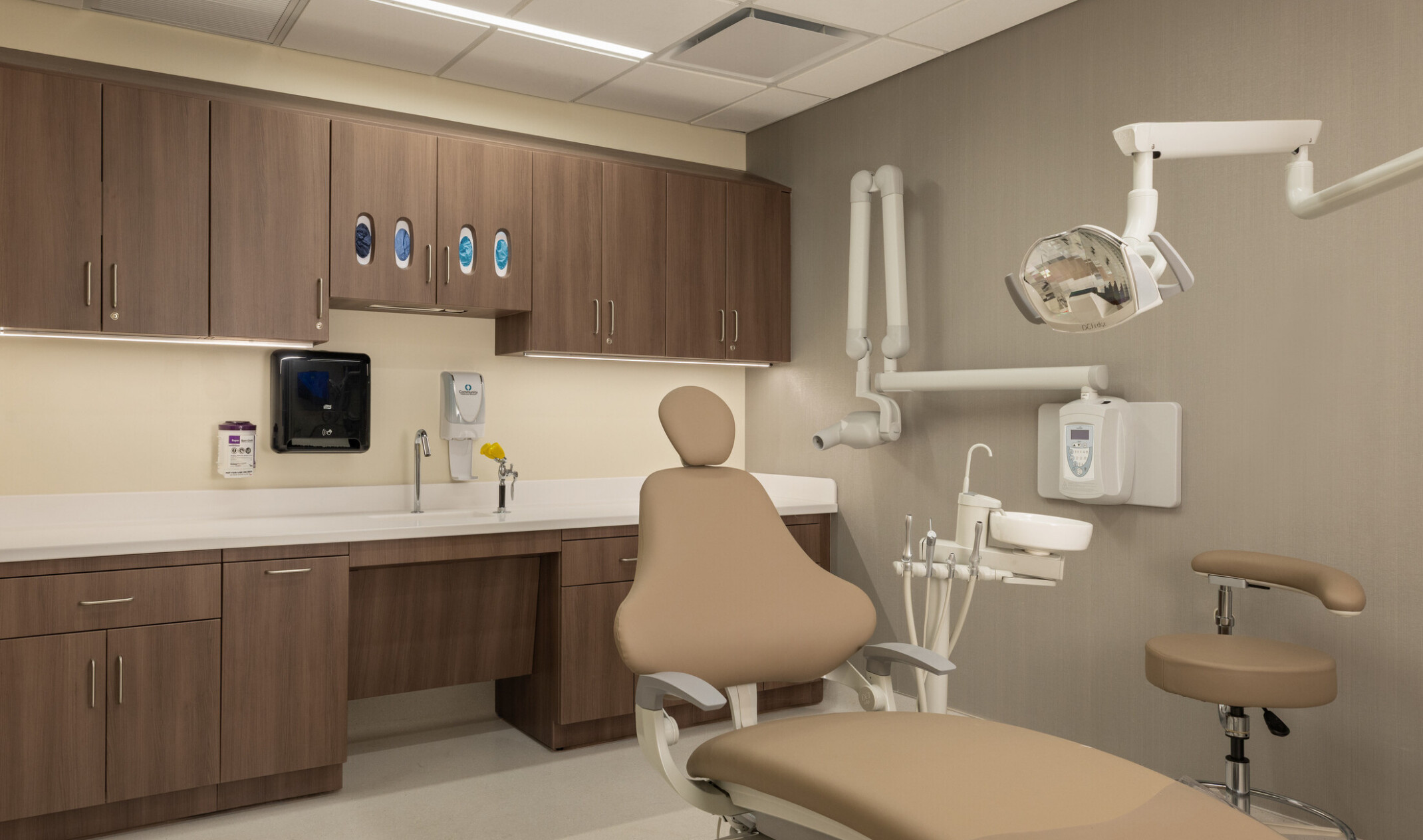 modern medical facility patient room; beige and light wood interior design