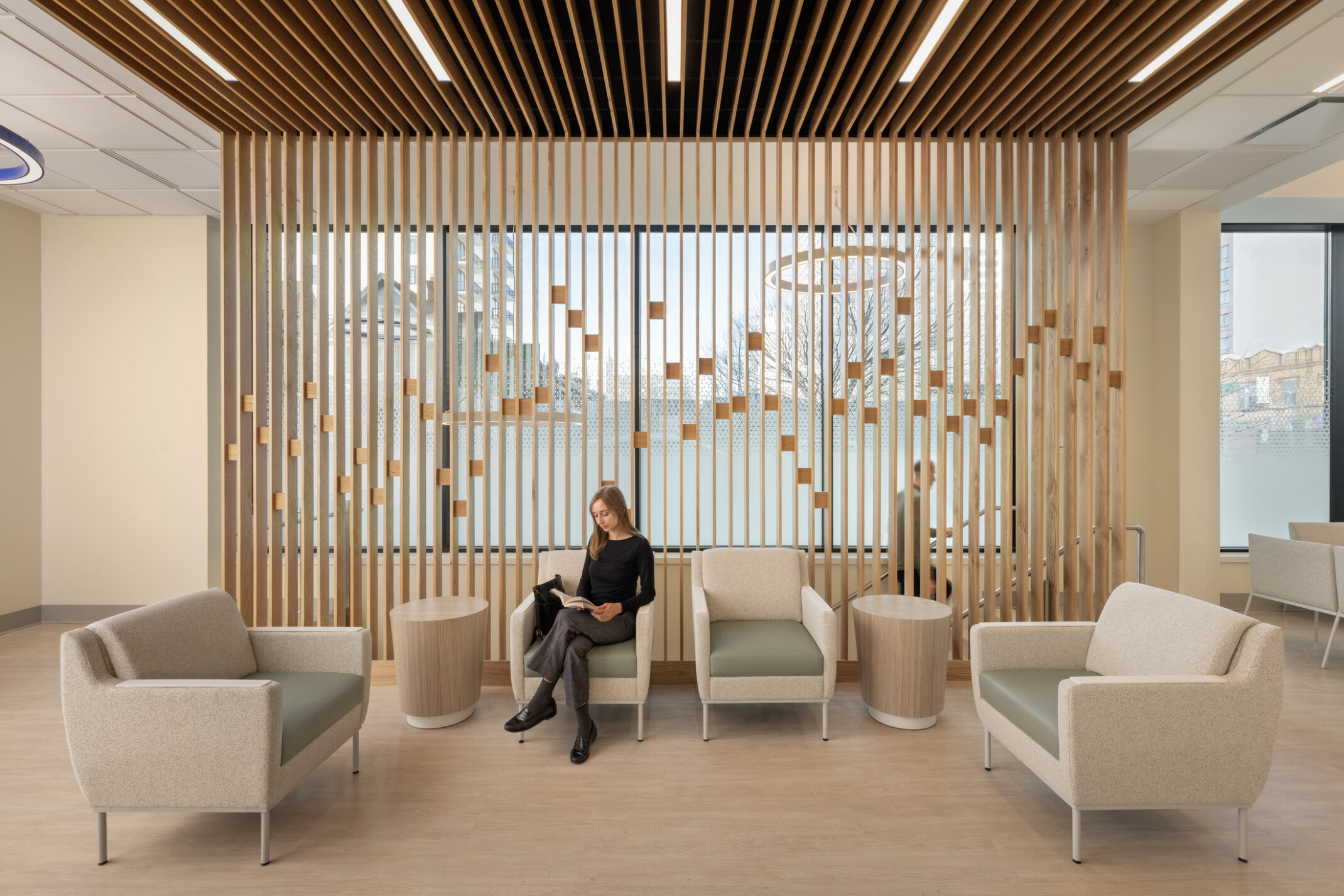 modern, light medical waiting room; hospitality inspired design with light wood and natural colors